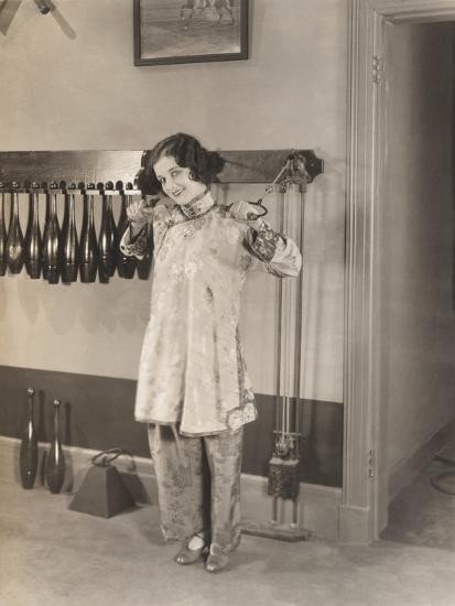 Woman in Silk Pajamas Exercising in Gym Photo Print | Art.com