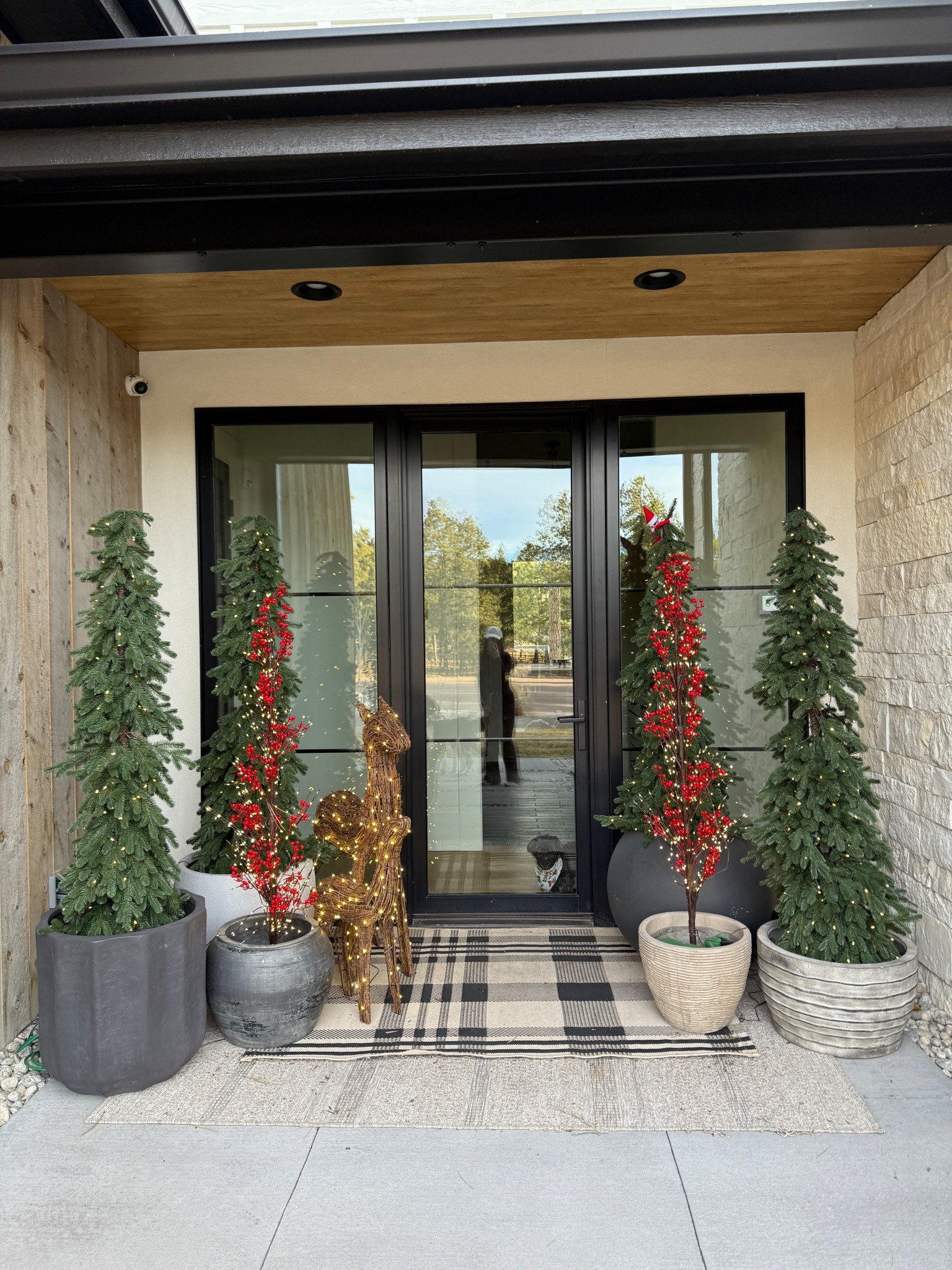 The side porch turned out so cute for Christmas! Loving the amount of texture in this little space with the mix of planters.

#LTKHoliday #LTKHome #LTKSeasonal