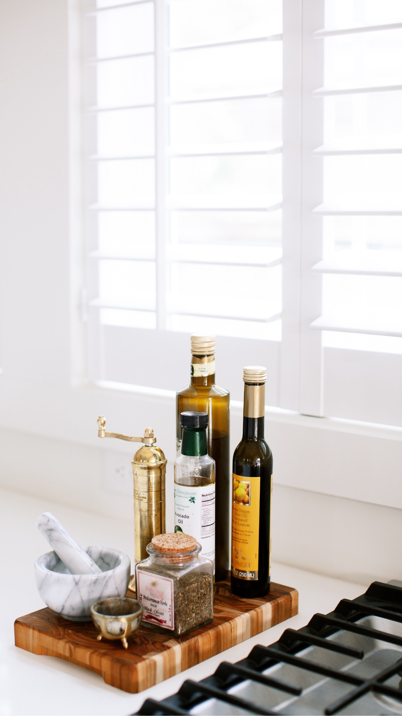 Functional kitchen styling! Bread board with brass peoper mill, pinch pot, and herbs and oils 

#LTKHoliday #LTKSeasonal #LTKhome