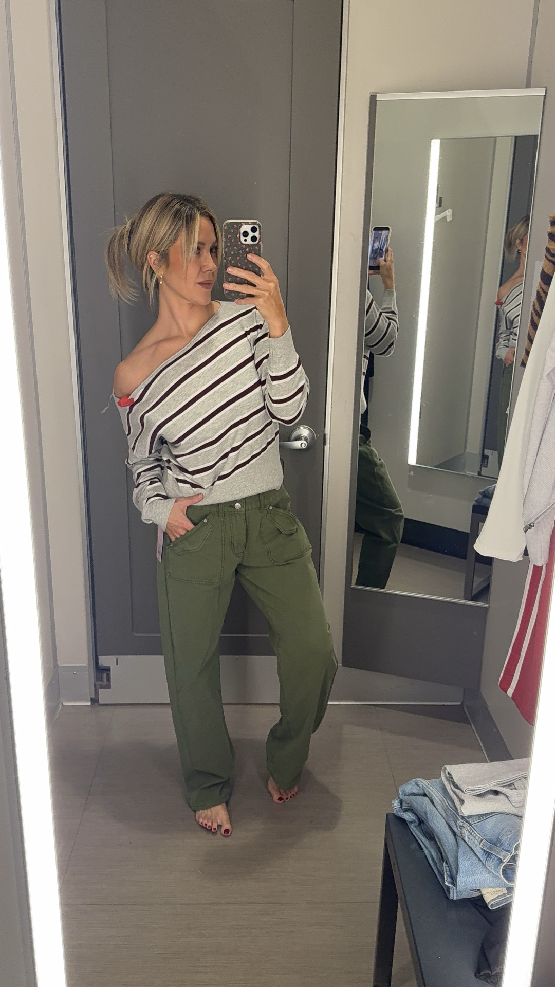 Target try on! These pieces are on major sale today - 40% off. wearing size 6 and a medium in the dark denim set. I loved this button up dark denim short sleeve button nap was so freaking cute - both run TTS. Wearing S in super cute side detail red sleeveless top! Love the fit - wearing size 8 in olive cargo pants for oversized fit. If you want them to fit oversized, size up one! Wearing M in basic gray tank and gray cardigan! Cardigan was super soft and flattering! Loved the fit - Wearing S in super cute cinched striped button down, loved this paired with the dark denim! Wearing M in both white long sleeve tee and red track pants - pants were super comfy I’m 5’7 so tall girl friendly! Run TTS. Wearing L in striped gray sweater I would have loved to do a medium, so it was tighter on the waist, but it was super soft and super flattering. I love the off the shoulder fit! Absolutely loved these boyfriend fit jeans they run true to size. I’m wearing a six - the wash is super high-end looking these could pass as designer jeans for sure. Also loved the black top wearing M super chic and could easily be dressed up or down!