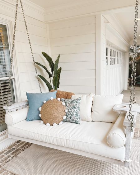 Outdoor front porch swing pillow decor from Lowe’s that is perfect for a Spring refresh- outdoor pillows, faux palm tree plant and ceramic scalloped planter 🌷 #frontporch #patio #lowes #spring #lowespartner #ad 

#LTKstyletip #LTKhome #LTKSeasonal