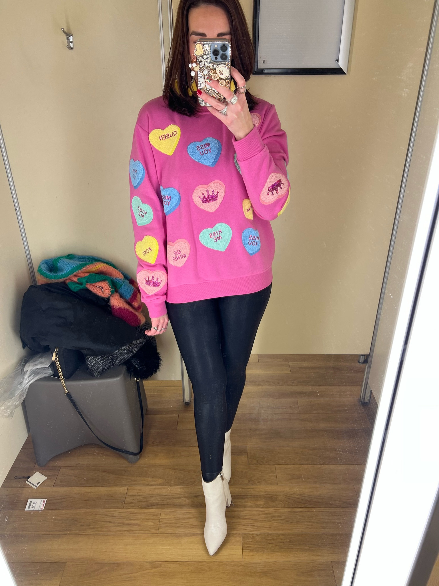 Candy hearts pink sweatshirt (small). Black faux leather leggings (small). White boots (8.5). #sweatshirt #sweatshirts #pinksweatshirt #candyhearts #candyheartssweatshirt #leggings #blackleggings #fauxleatherleggings #whiteboots #boots #winteroutfit #valentinesdayoutfit Winter Outfit Valentine’s Day Outfit 

#LTKSeasonal #LTKFindsUnder100 #LTKStyleTip
