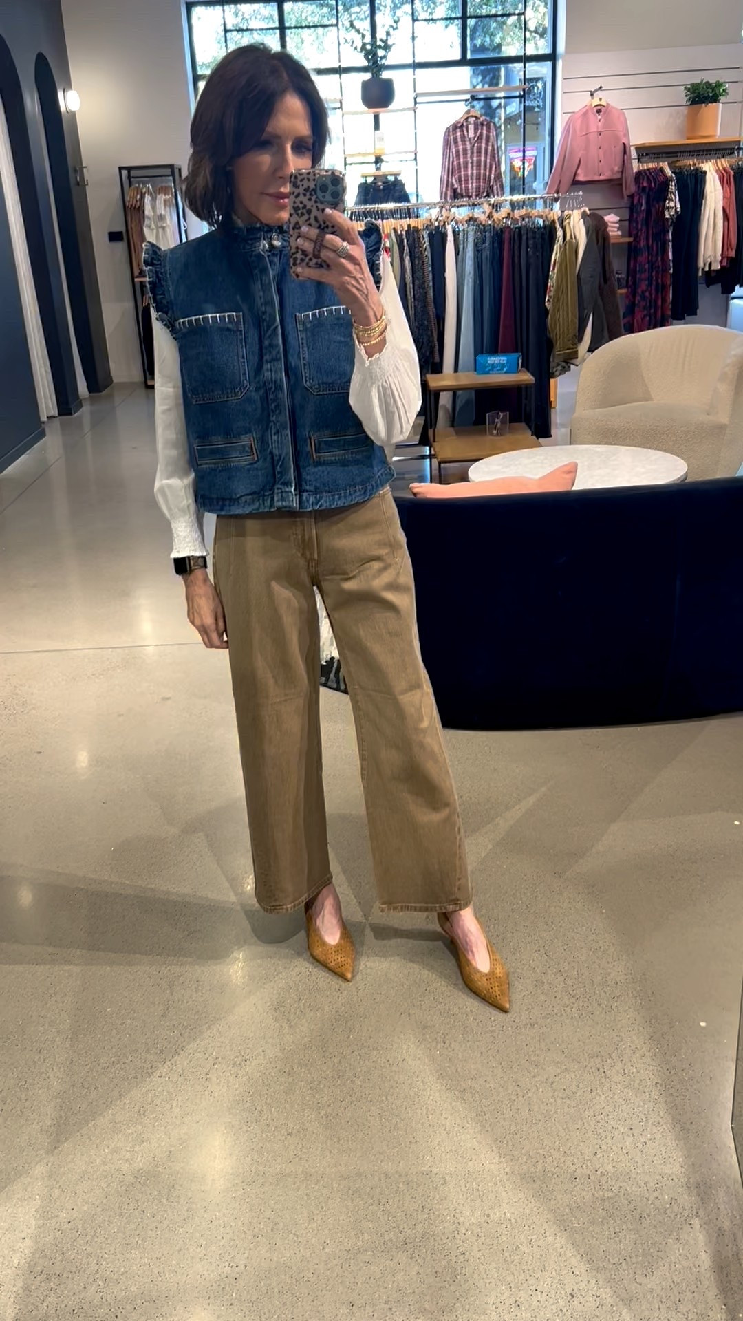 white ruffle neck top, denim vest, tan wide leg jeans, laser cut heels, over 50 outfits, neutral outfit 

#LTKootd #LTKOver40 #LTKSeasonal