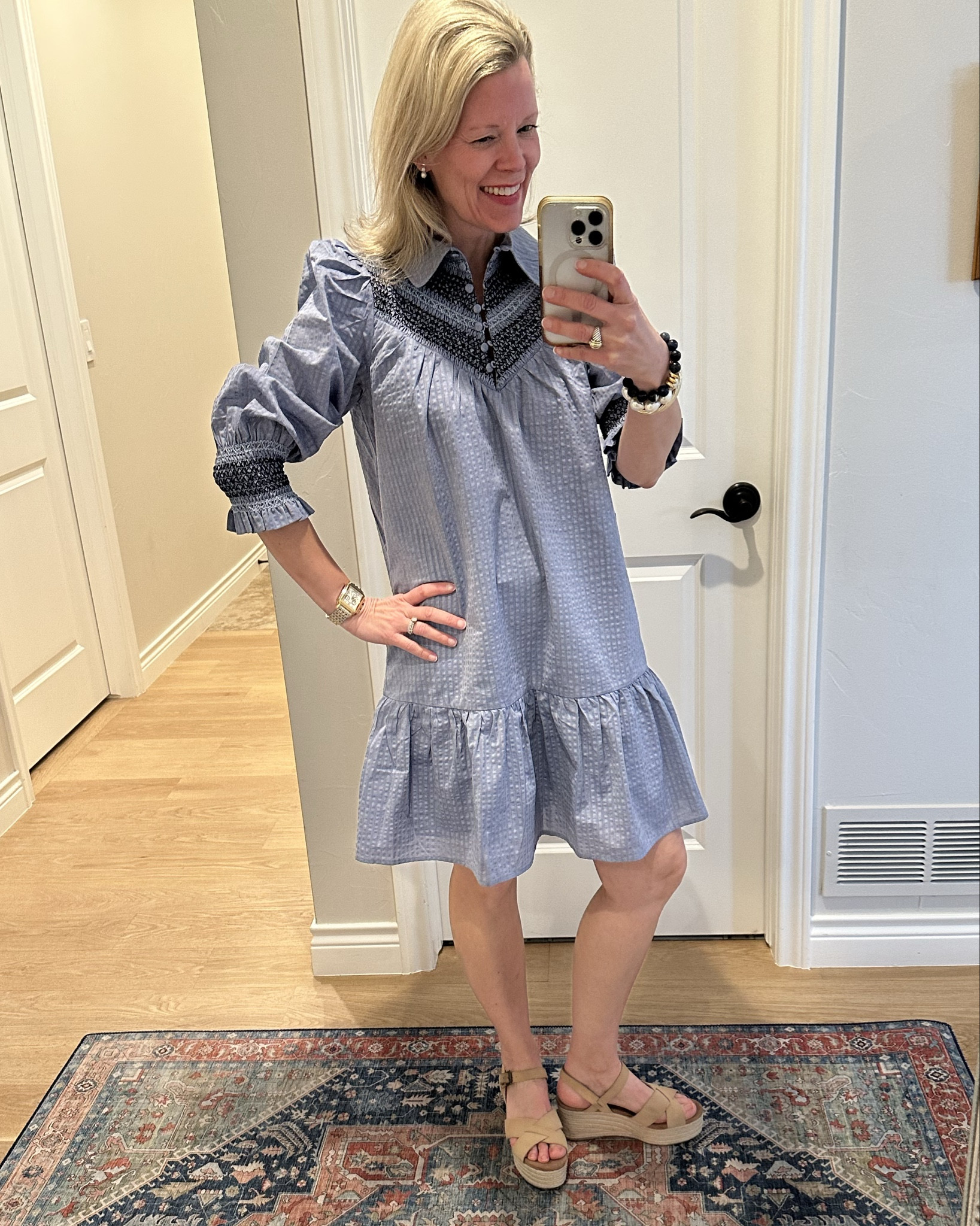 Love this pretty blue dress that’s perfect year-round. It has so many feminine details that make it really special. I love the fit of it, the dark blue smocking, and embroidery and the pretty covered buttons. It fits true to size.  I am in between an extra small and a small and got the extra small and love the fit.  You can dress it up or dress it down. So excited about this new dress!
Spring dress. Easter dress. Travel outfit. Work dress.  Tuckernuck  

#LTKSeasonal #LTKWorkwear #LTKWatchNow