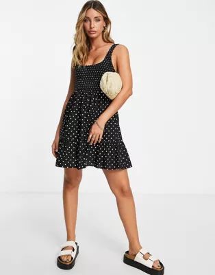 ASOS DESIGN shirred mini sundress with tiers in mono spot print | ASOS (Global)