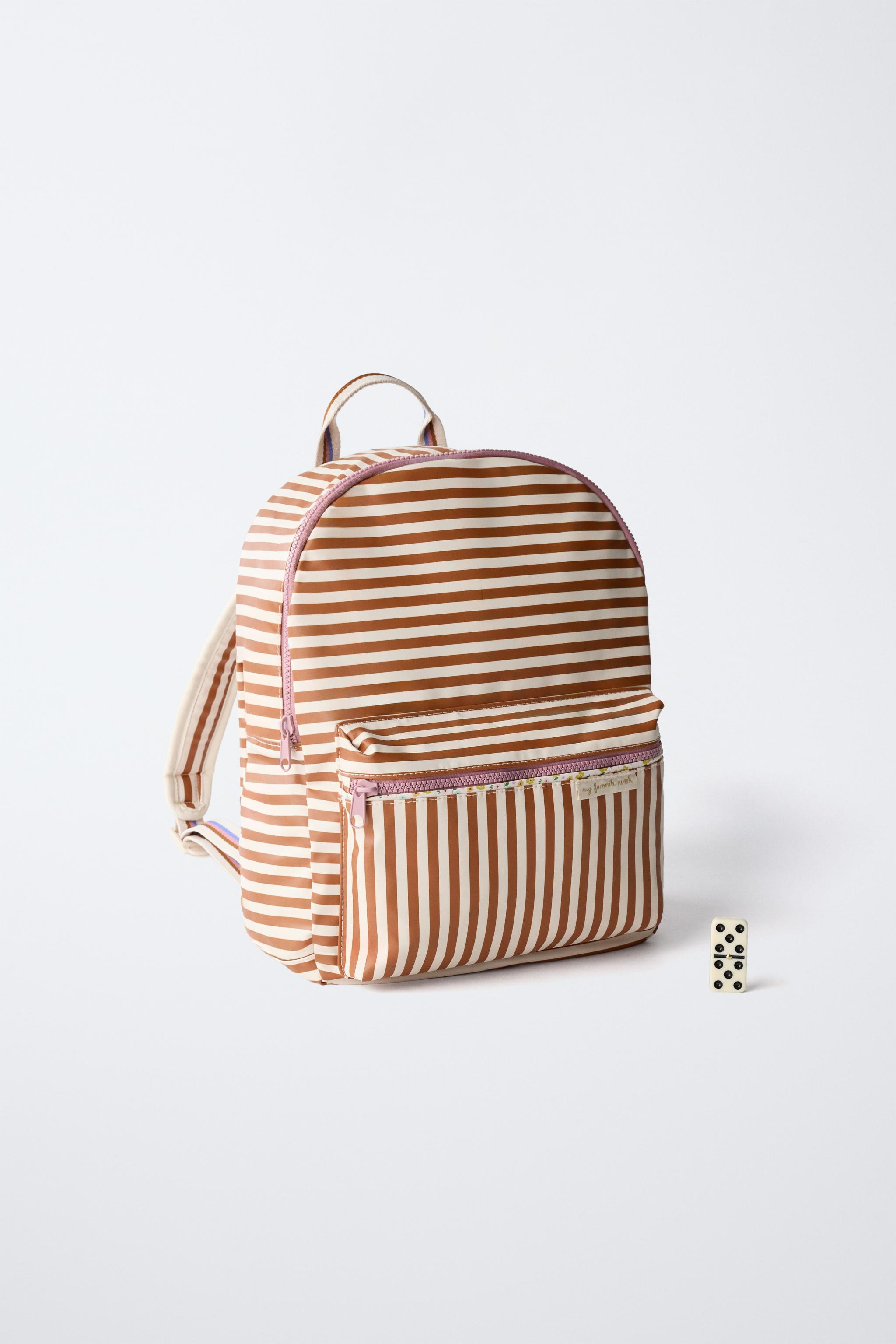 Rubberised backpack with stripe print. Main compartment with zip closure. Features a front pocket... | Zara UK