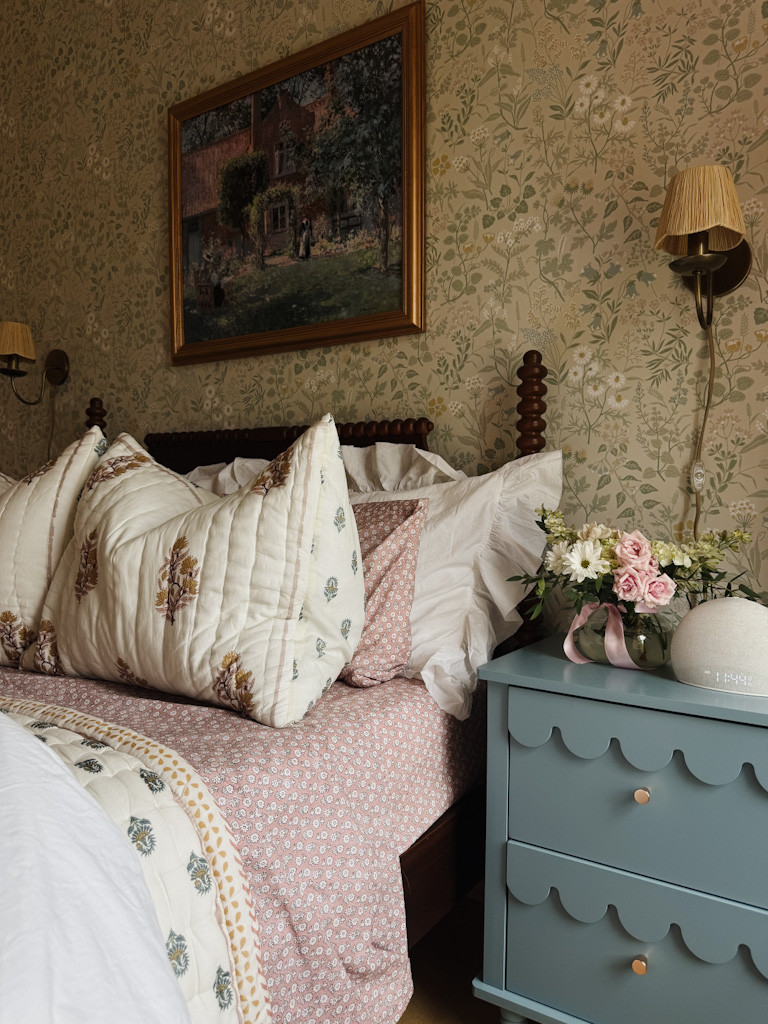 🌼 Close-up of the coziest corner in Lennon’s room…
The floral wallpaper, scalloped nightstand, and block print bedding make this space feel like a little English cottage. It’s all in the layers — and the mix of warm tones and timeless patterns. 💐✨

🛏️ Shop the details:
– Block print pillows + quilt
– Pink floral sheets
– Scalloped blue nightstand
– Pleated sconce wall lamps
– Vintage-style framed art
– Botanical wallpaper
– Mini vase + floral arrangement

Perfect for anyone curating a romantic, traditional bedroom with personality and warmth. 🌿

#LTKhome #englishcountrydecor #vintagebedroom #cottagecoreaesthetic #southernhomestyle #blockprintbedding #floralwallpaper #scallopednightstand #girlsroomdecor #ltkbedroom #closeupdetails #traditionaltouches #ltkfinds 

 