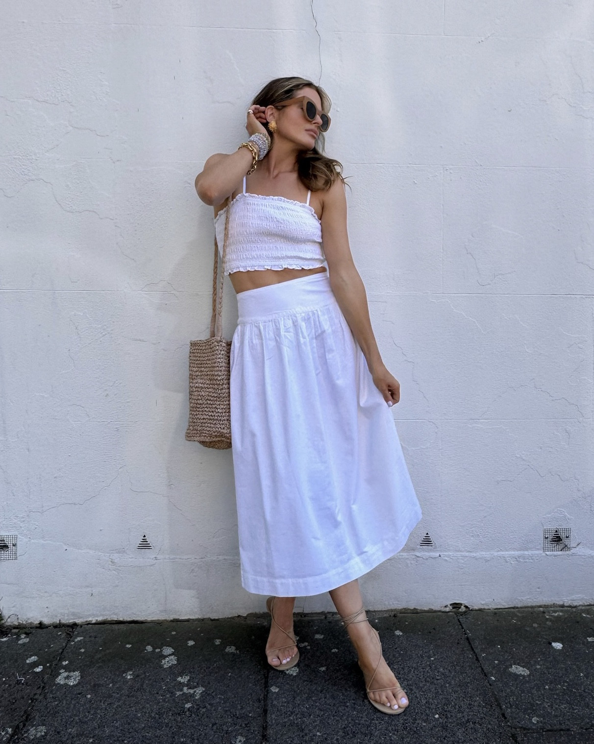 White shirred cami top | White drop waist maxi skirt | Raffia bucket bag | Nude strappy sandals | Chunky sunglasses 

Summer outfit | Nobody’s Child 

#LTKeurope #LTKsummer #LTKuk