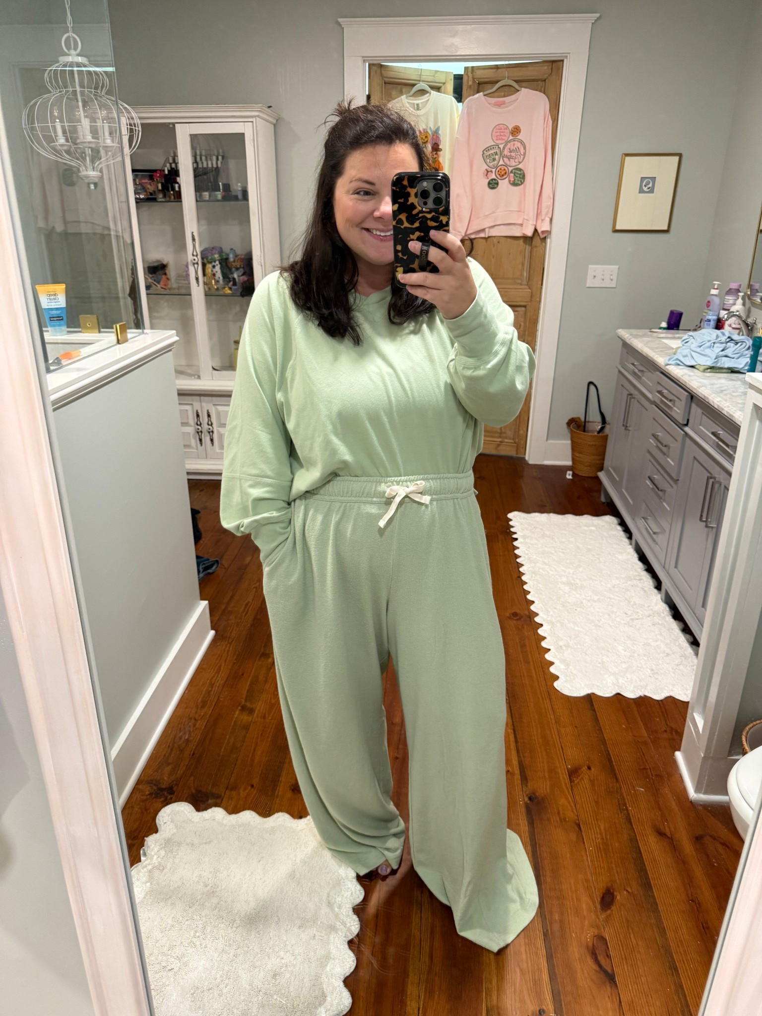 Wearing an XL in the top and a L in the bottoms. I’m 5’3 and will have a few inches taken off the bottoms but they’re SO comfy! 