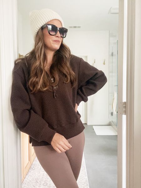 New in from Varley! Love this outfit for Fall and feeling this chocolate brown color. Wearing a small in the Fleece pullover, small in the leggings, knit beanie. 

#LTKSeasonal #LTKfitness #LTKfindsunder100