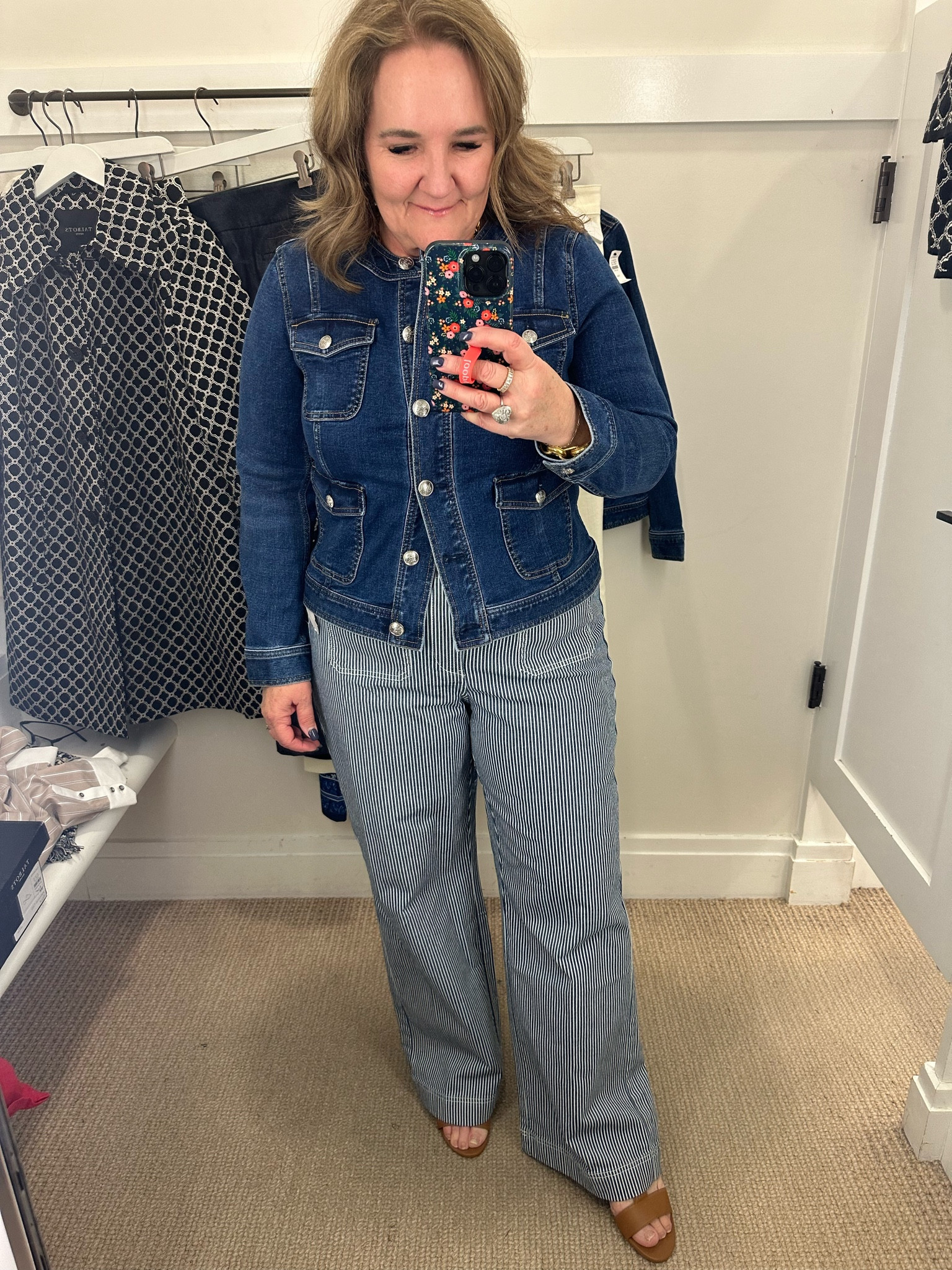 This denim jacket is a great staple. And I love the lady jacket styling of it. It does have stretch. I am wearing a size large petite. I couldn’t layer a bulky sweater under it but I really liked the fit.
The jeans are a fun pinstripe denim. A moderate wide leg with front patch pockets. I am wearing a size 14 regular. And they are a relaxed fit. I would suggest going your smaller size for a more fitted look  

#LTKover40 #LTKsalealert #LTKmidsize