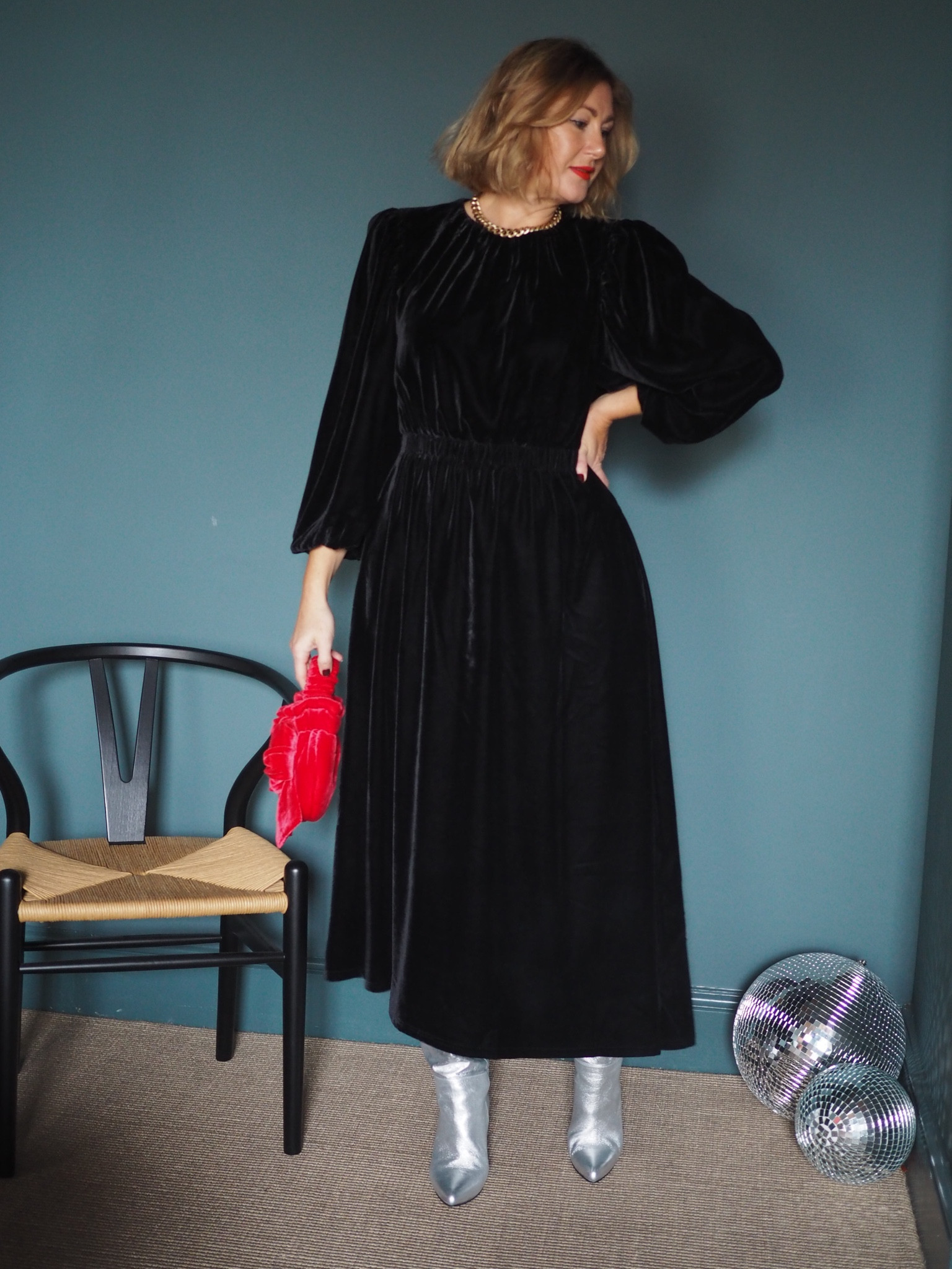 Long sleeve black maxi velvet dress, silver boots, red bag

#LTKSeasonal #LTKstyletip #LTKeurope