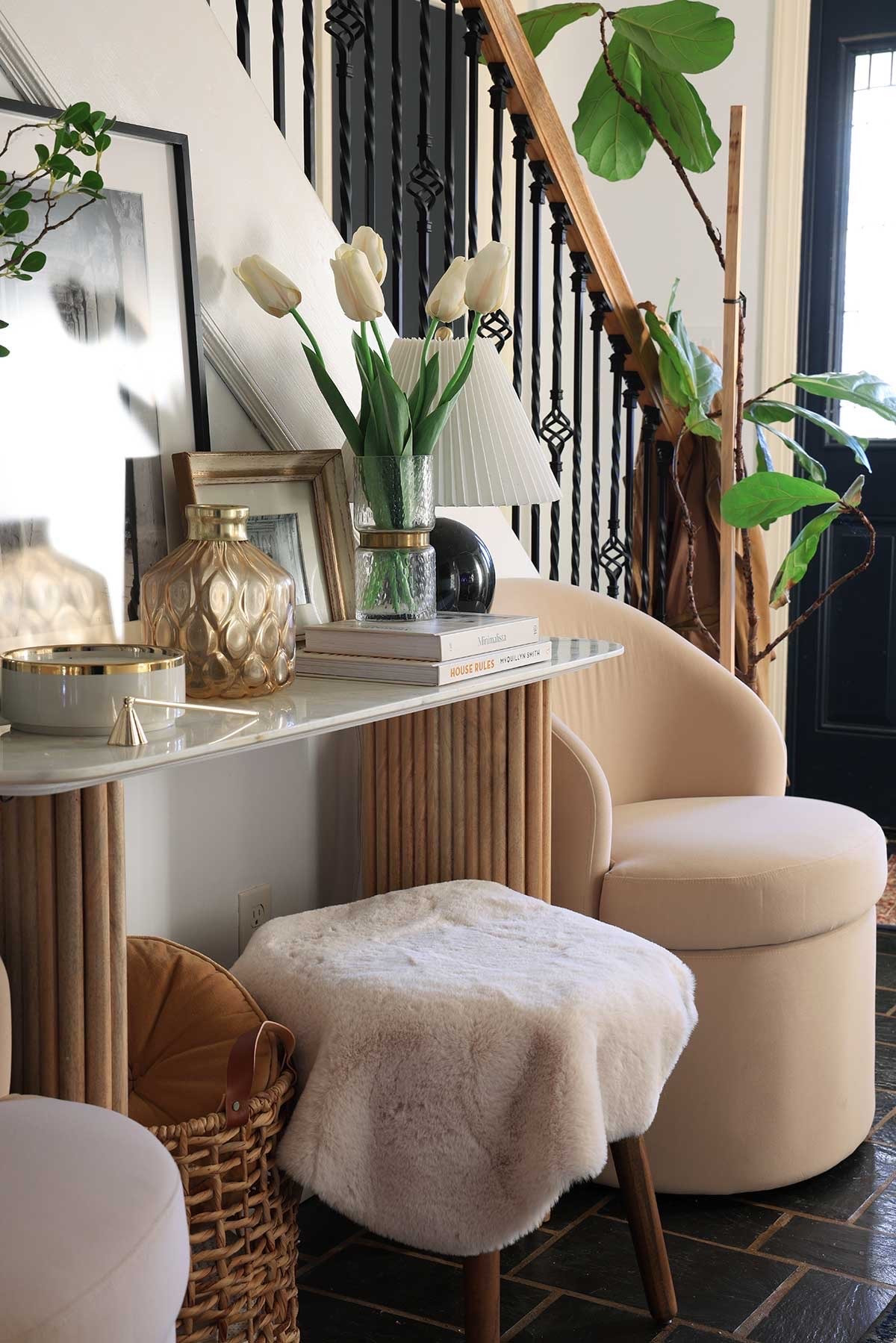 Foyer styling and organization with a fluted console table and marble top, storage chairs, lamp and lighting, art, and decorative accessories.

#LTKHome