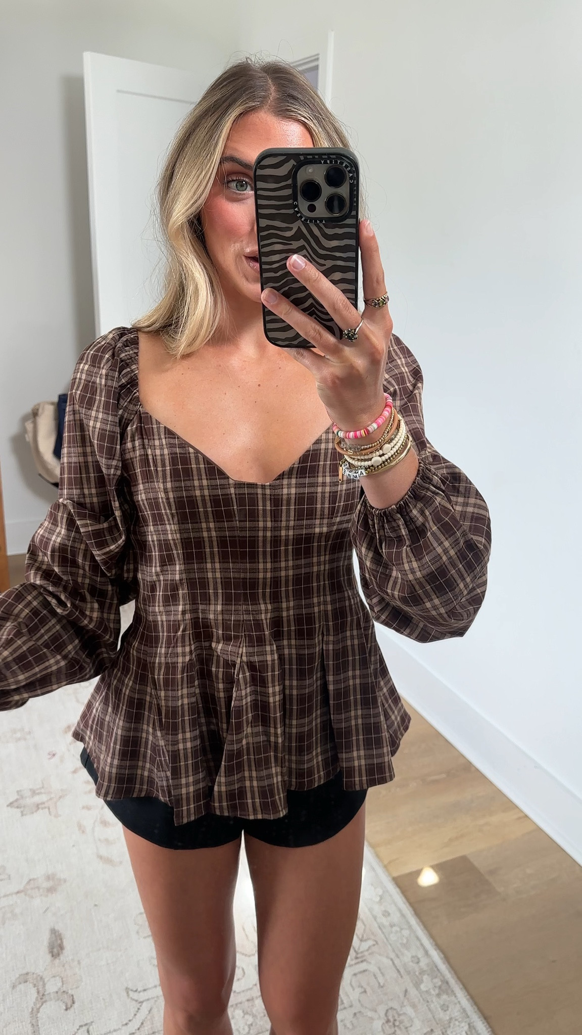 Baltic Born size small. (Wish I had XS). My code is SLOANE15. The Sutton Peplum Top in Brown Plaid Print is a feminine silhouette designed with structured shaping and soft volume for elevated everyday styling. Featuring a classic plaid print and flattering fit details, this top blends timeless charm with a modern silhouette

#LTKootd #LTKWorkwear #LTKSaleAlert