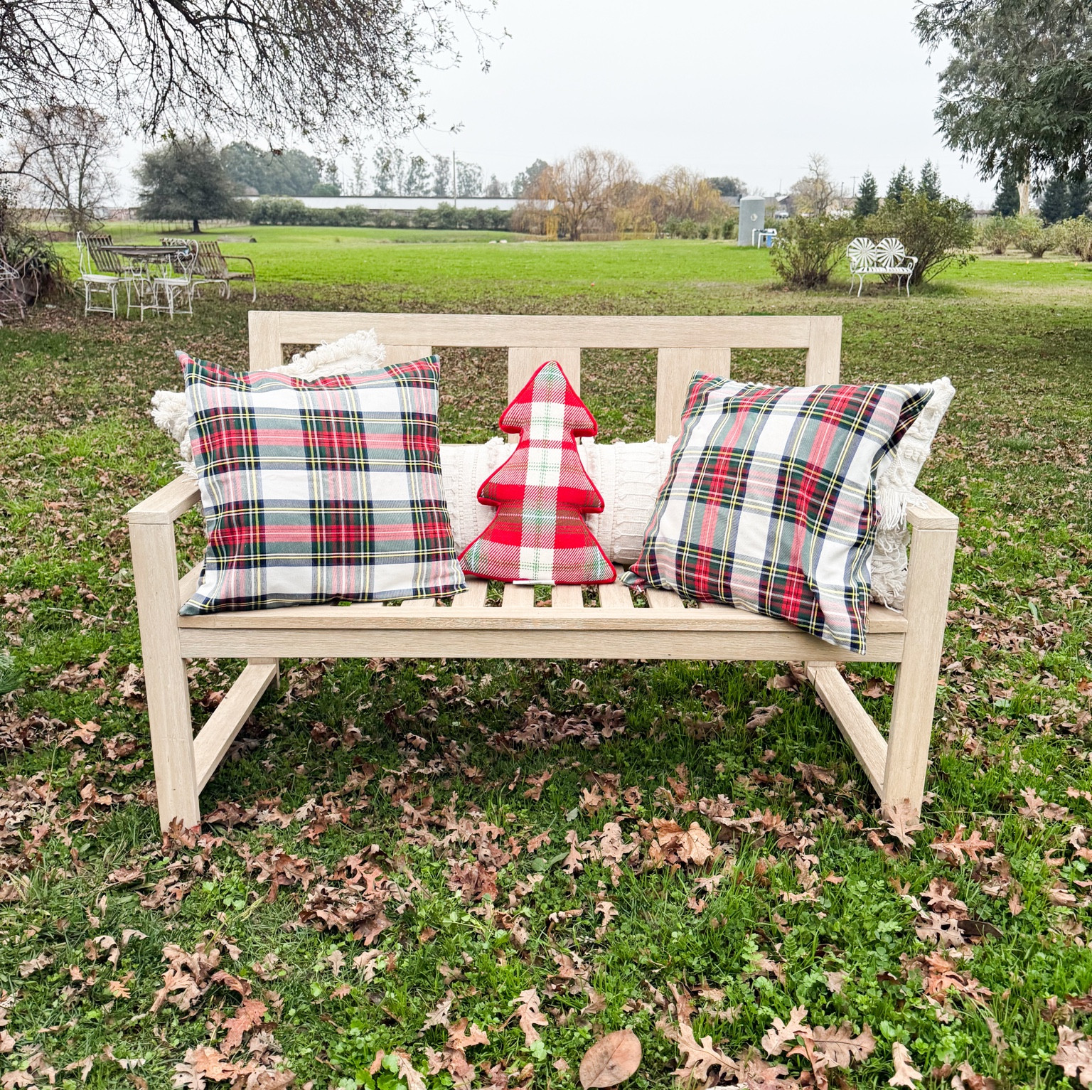 Living this outdoor bench adorned with neutral pillows and plaid Christmas pillows! I love mixing and matching prints and shapes! This plaid Christmas tree pillow is only $20 with free shipping or delivery! ❤️🎄🎅🏻 

#LTKGiftGuide #LTKHome #LTKHoliday