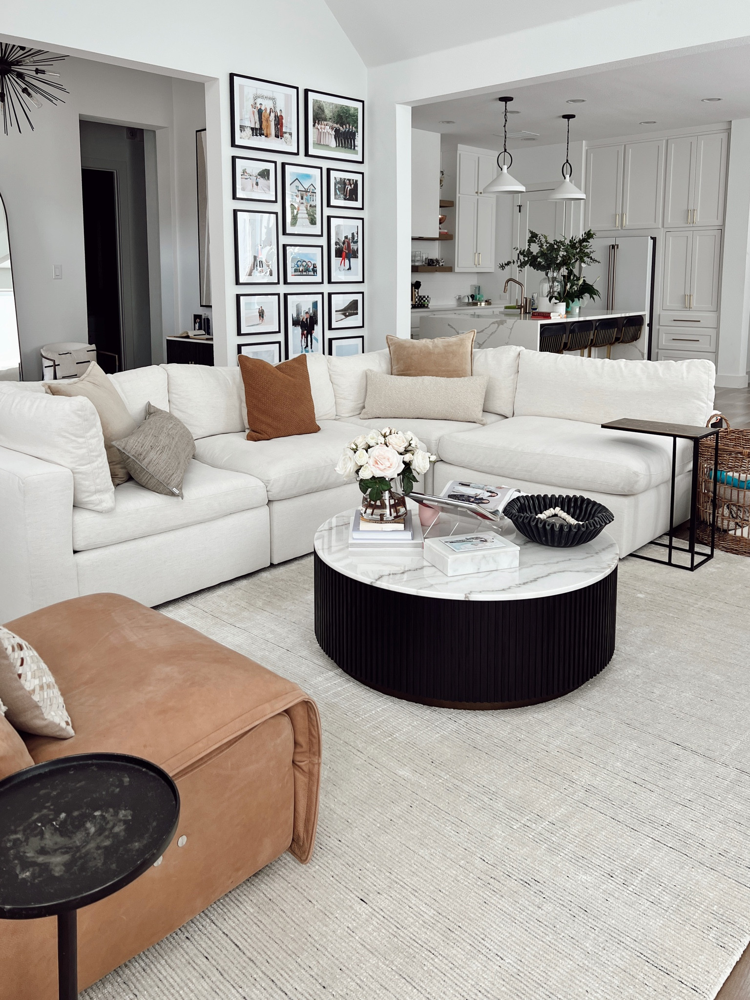 Living room decor for a transitional home. Love this Arhaus Beale white sofa because it’s so comfortable and easy to clean! The fabric repels spills and stains since it’s performance. Also linking our ivory area rug, leather recliner, marble coffee table and coffee table styling decor   

#LTKSeasonal #LTKhome #LTKsalealert
