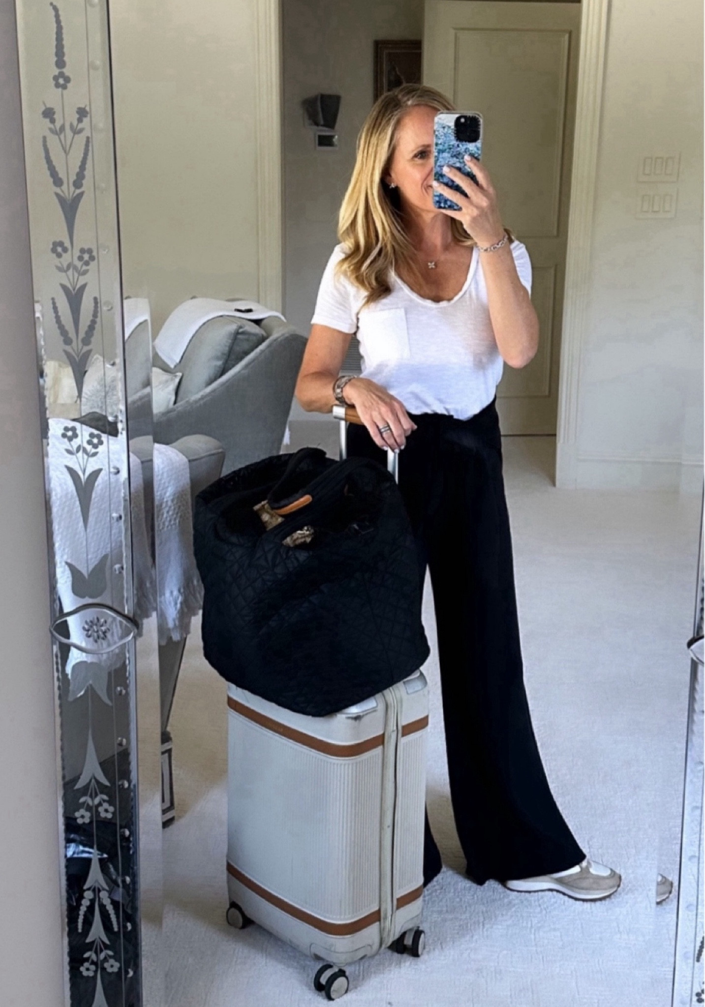 All my travel favorites are going to here!
I love traveling in the Spanx AirEssentials wide leg cropped pants. I am wearing extra small petite and I’m 5‘2“ tall for length reference. 
This thanks Spanx AirEssentials half zip is tied around my waist for when it gets cold on the plane
This is my favorite carry-on suitcase, the Paravel aviator plus 
Best carry-on, travel, tote, MZ, Wallace metro tote 
My favorite packing cubes travel curling iron steamer 

#LTKOver40 #LTKTravel #LTKStyleTip