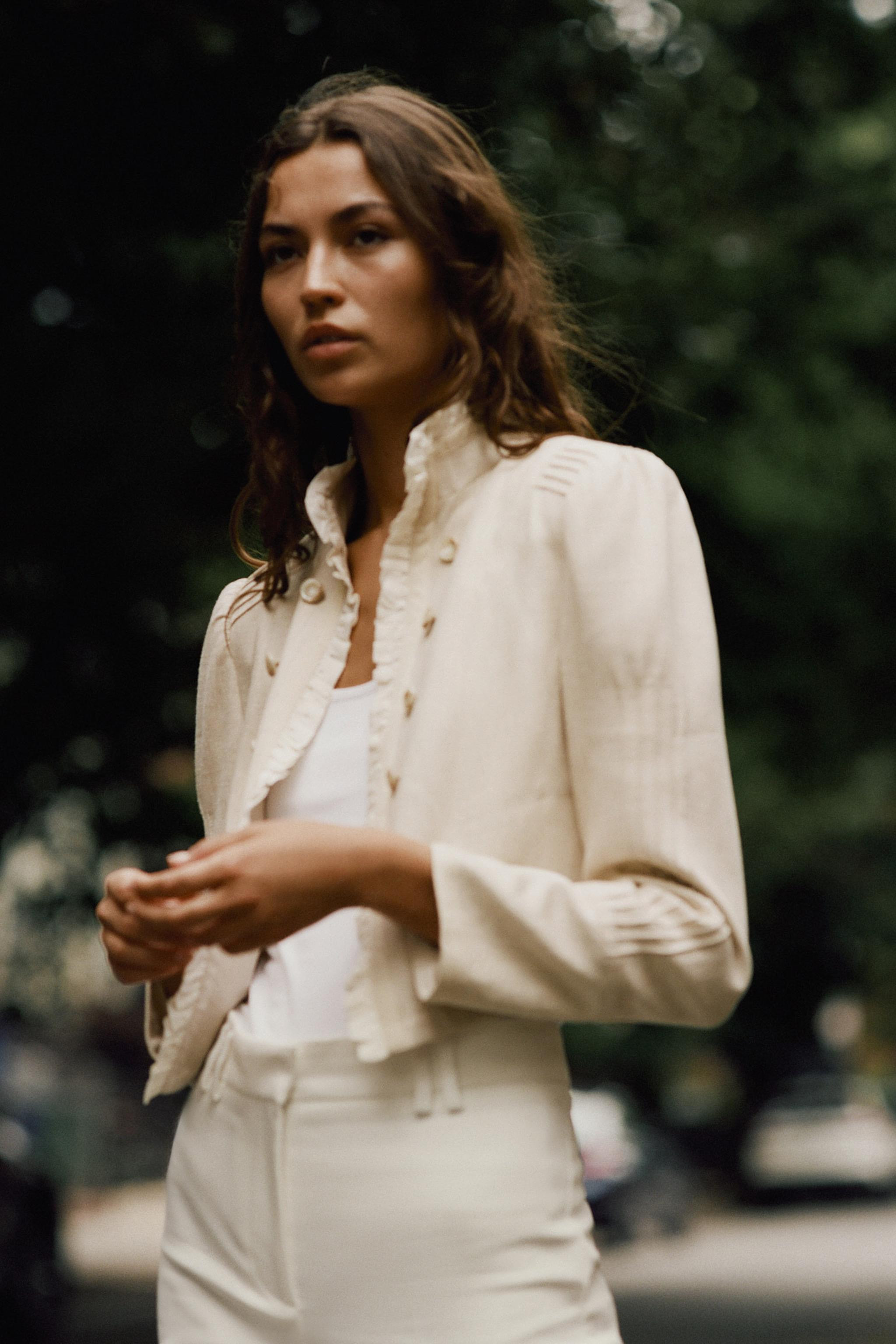 Open blazer featuring ruffles, long sleeves with shoulder pads, and pintuck detailing. Faux front... | Zara US