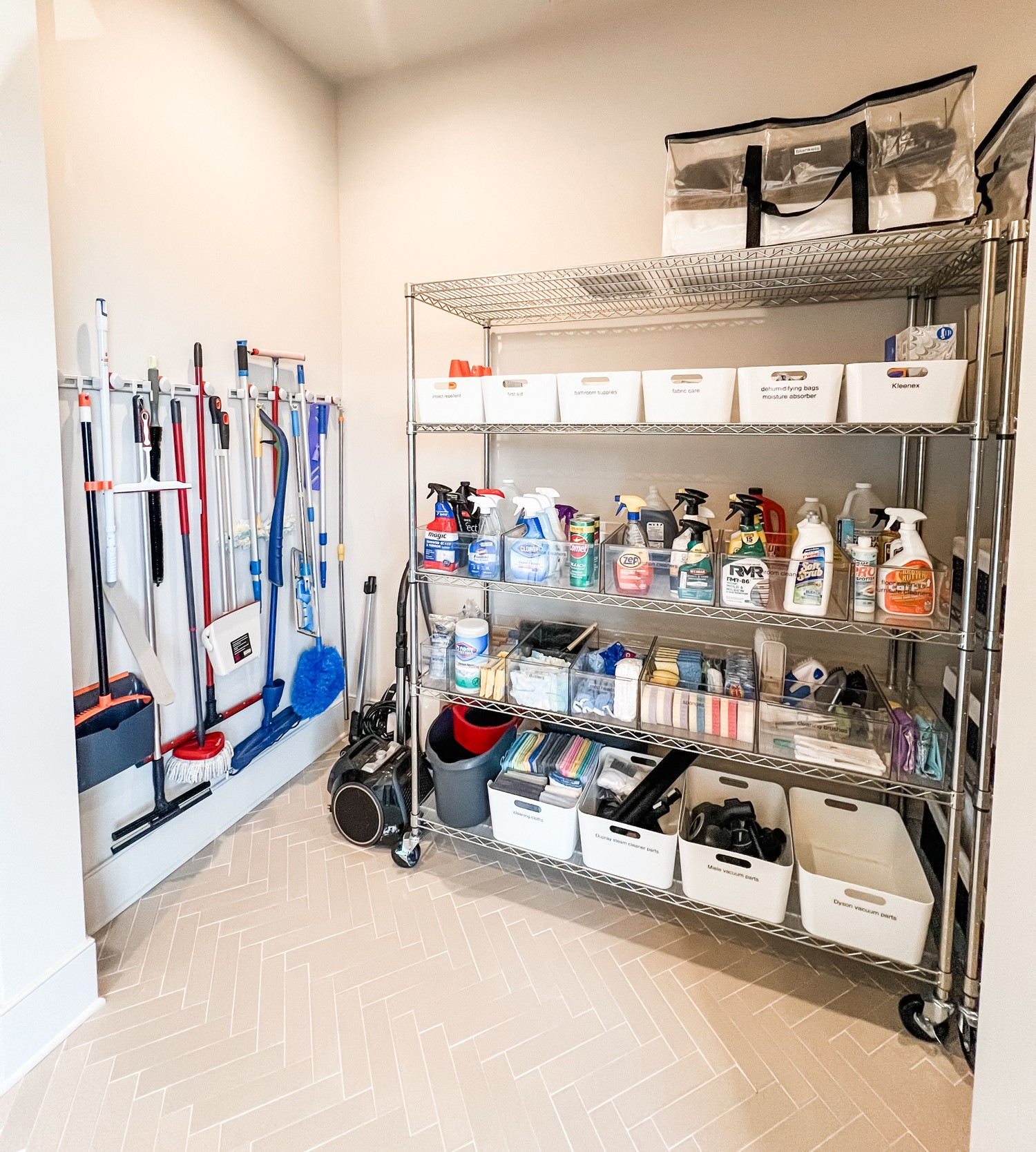 Amazing storage isn't always built in and this space is the perfect example, especially when you have cleaning supplies for days. This laundry room had a great open space but needed a functional storage solution to keep things off the ground, so adding this shelving unit and stocking it with labeled bins for grouping like things hit the mark. We're also suckers for wall-mounted utility holders as they're a perfect way to keep the floor clear and the items organized.

How's your laundry room situation? If it needs some help, drop us a line! 

 