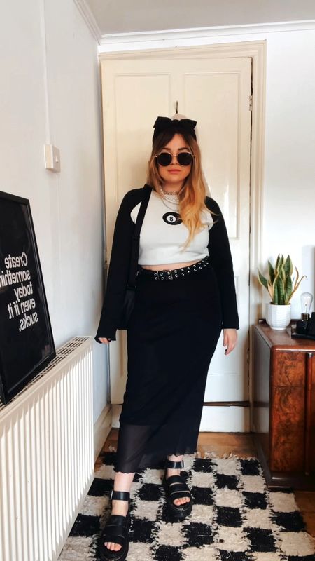 Black and white eight ball raglan style jumper  with a black mesh midi skirt and doc marten sandal. 

#LTKunder50 #LTKSeasonal #LTKeurope