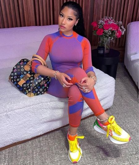 @nickiminaj wore a #Y3 red and purple $190 knit long sleeve with the matching $160 knit leggings and accessorized with $790 AlexanderMcQueen color block sneakers and a $1,775 #louisvuitton Murakami collection handbag. What say you? #Hot! Or Hmm…? 

📸: @nickiminaj 

#Nickiminajfbd
Blogged by @sohotoboho