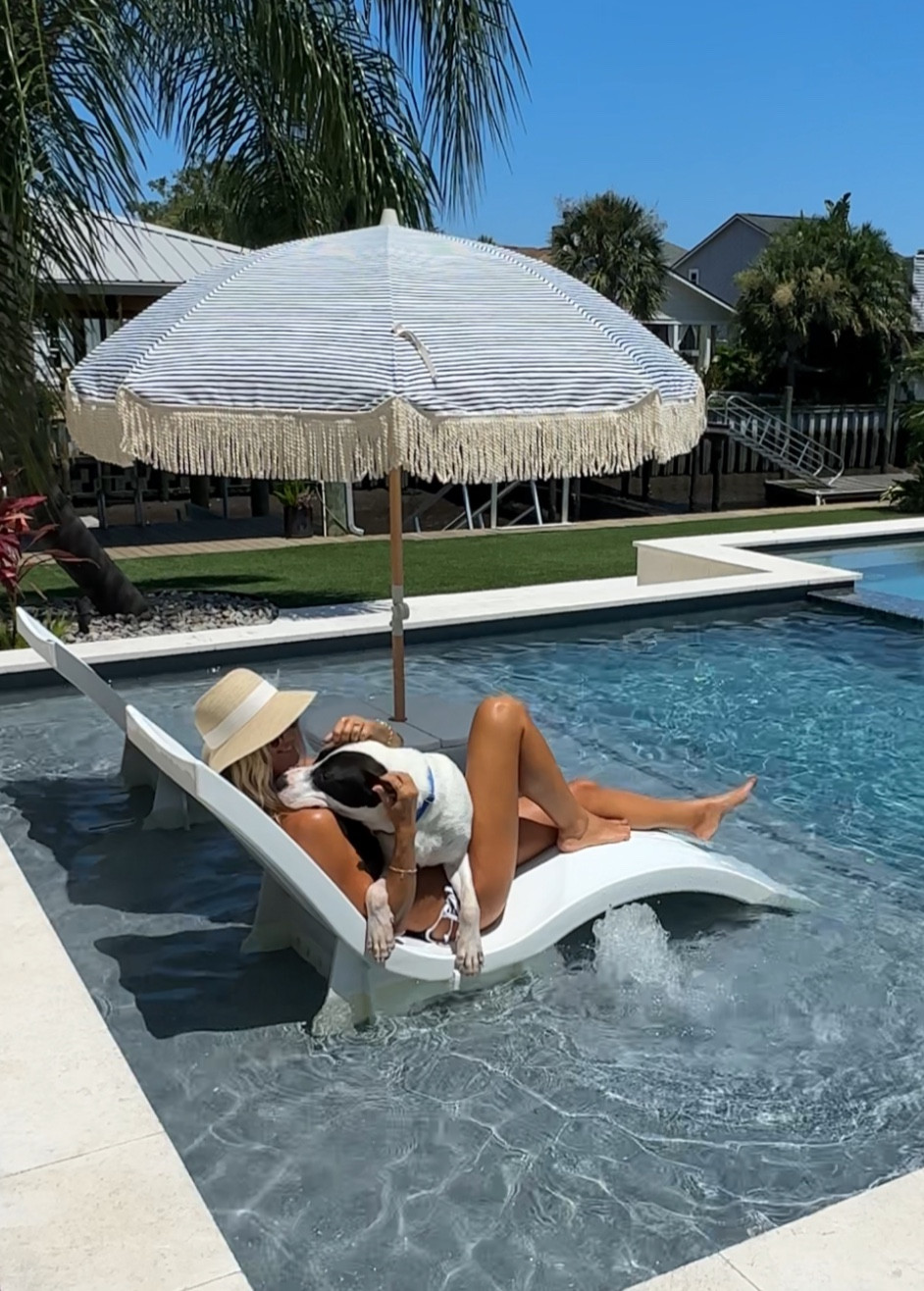 Pool furniture ledge lounger chaise lounge 
Tassel striped umbrella sun hat backyard goals summer outdoor living
