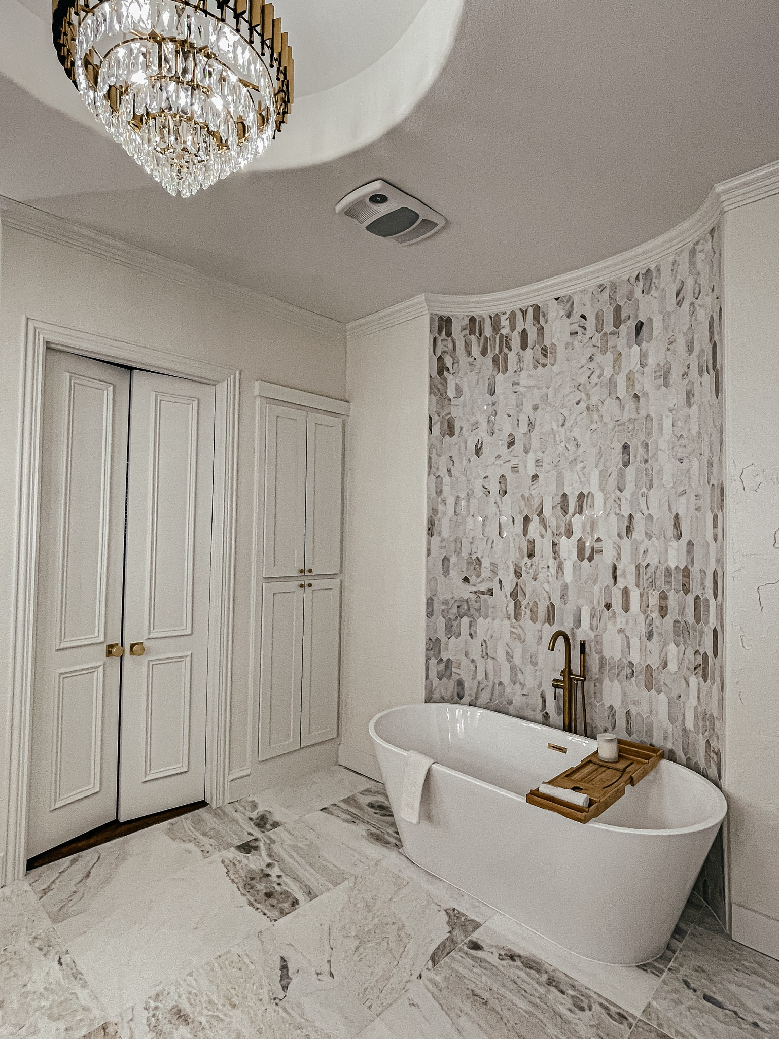 Bathroom decor. Home decor. Bath tub. Lighting. Chandelier. Primary bathroom. Tile. 

#LTKActive #LTKSaleAlert #LTKHome
