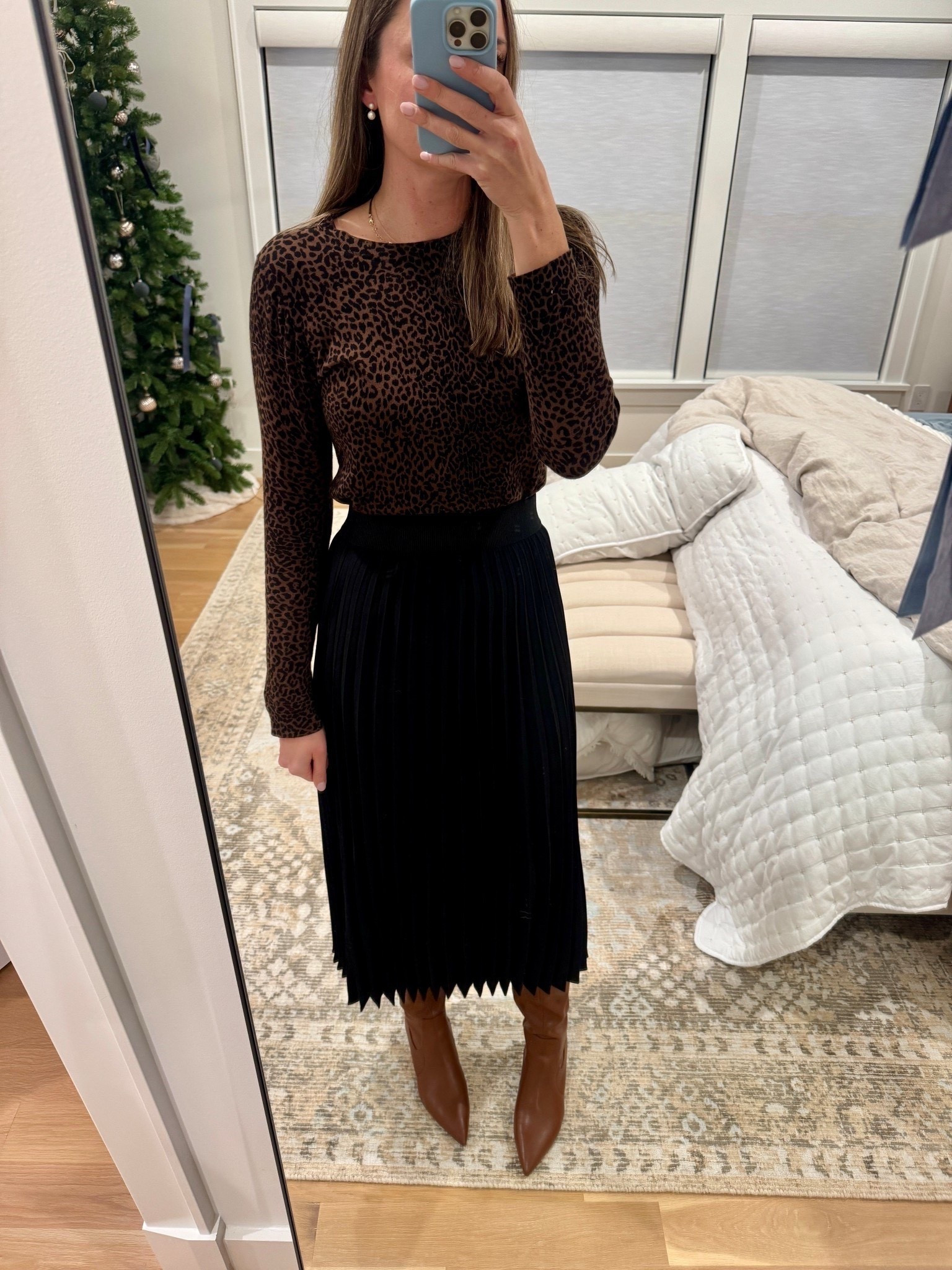 Holiday outfit! Love this pleated back midi skirt - pair with a light sweater and boots or heels! 

#LTKFindsUnder100 #LTKSeasonal #LTKHoliday