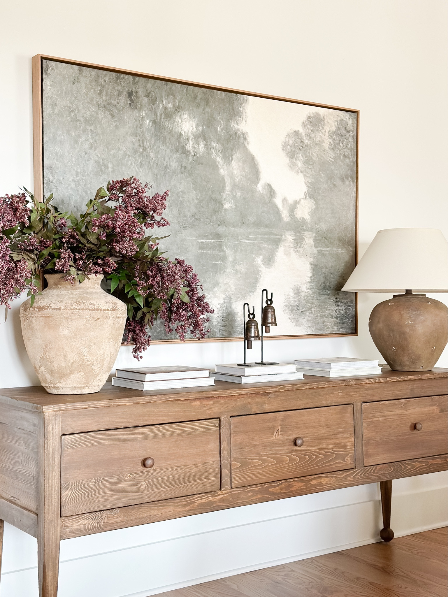 This gorgeous console completes any space! It also comes in a dreamy black! It is 75” wide and 32” high and the depth is 20”. The deep drawer space is amazing! Shop this look! Also, you can shop this beautiful console table at Home and Kids Co.

#console #consoletable #entrywaytable #consoledecor #livingroomdecor #falldecor #wallart #canvasart #tablelamp #vase #coffeetablebooks 

#LTKHome #LTKStyleTip #LTKSeasonal