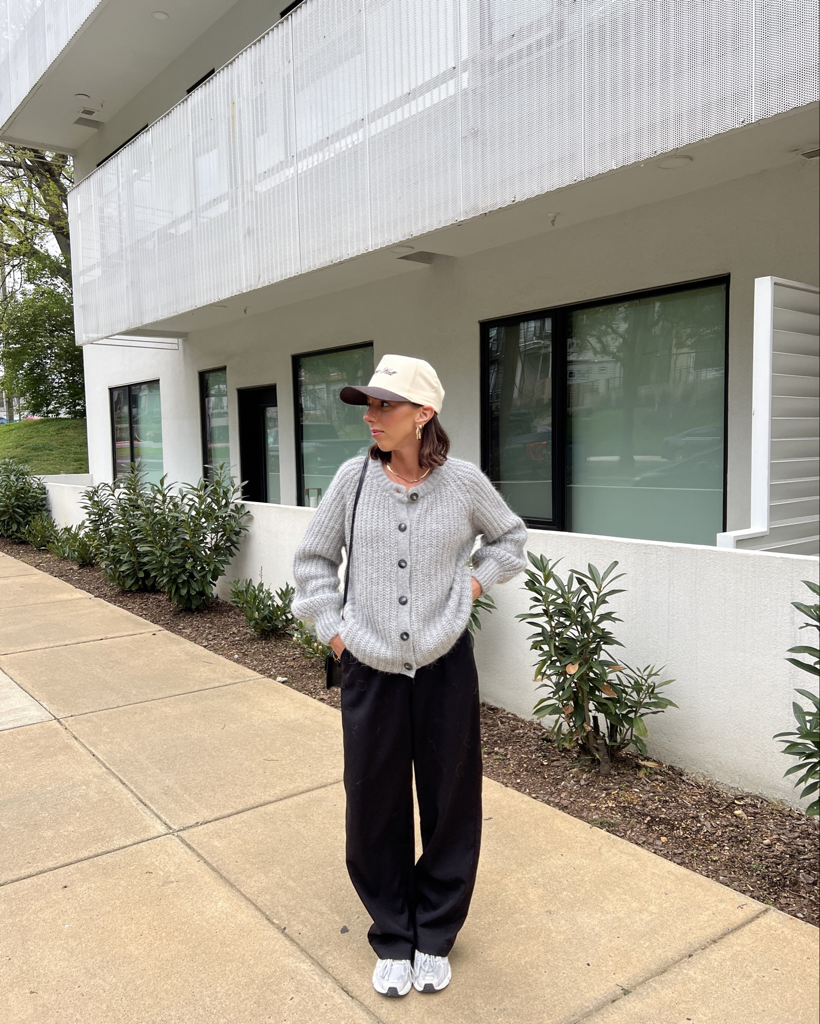 Casual outfit ft. Sezane Sweater with black trousers and tennis shoes trucker hat from Uncommon James and black faux leather mango bag/purse - what I wore in Nashville 

#LTKstyletip #LTKfindsunder100 #LTKshoecrush