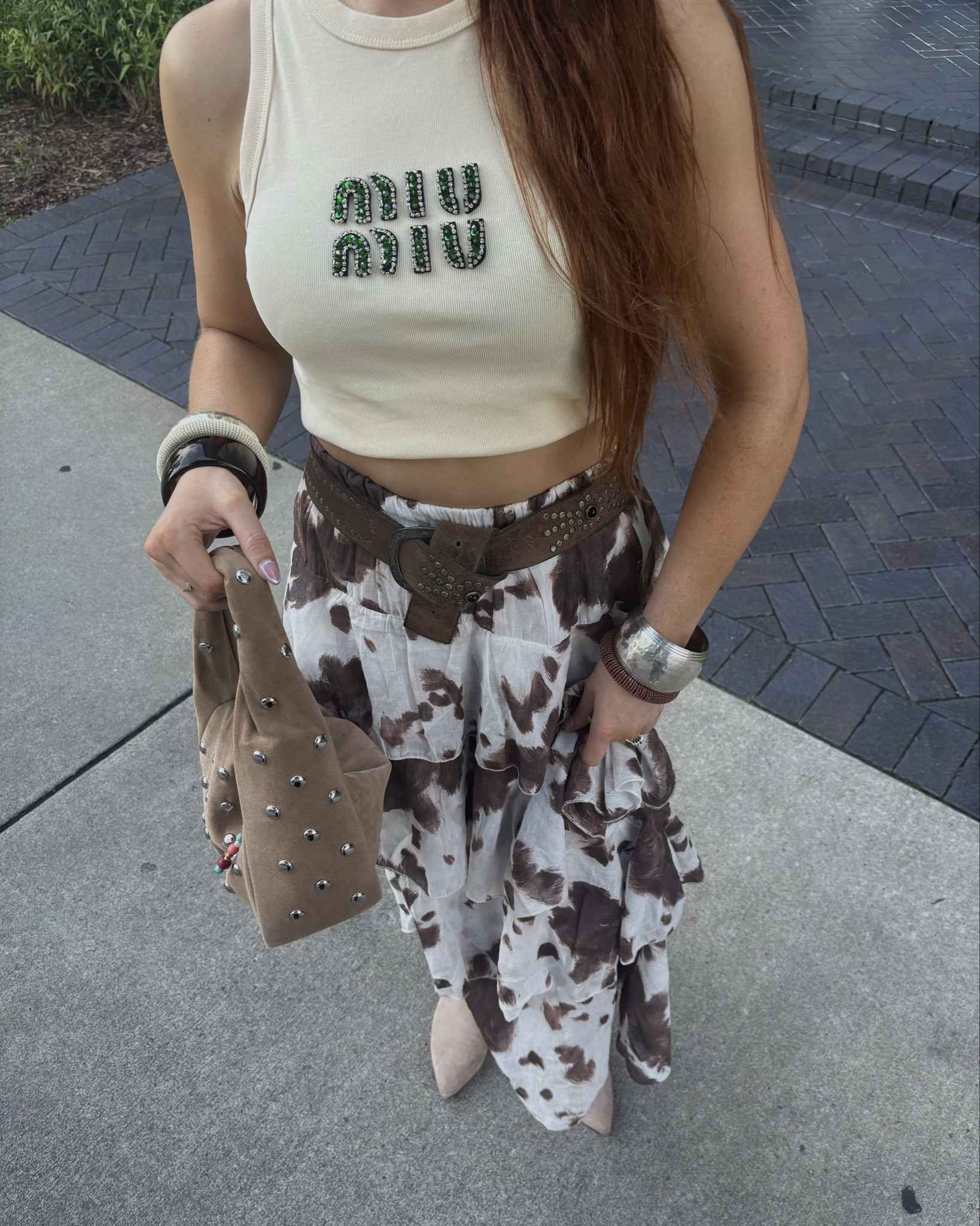 Nashville night outfit🐮

Cowprint maxi skirt, butter yellow, suede handbag, suede and studs, cowboy boots outfit 

#LTKdatenight #LTKsummer #LTKuk
