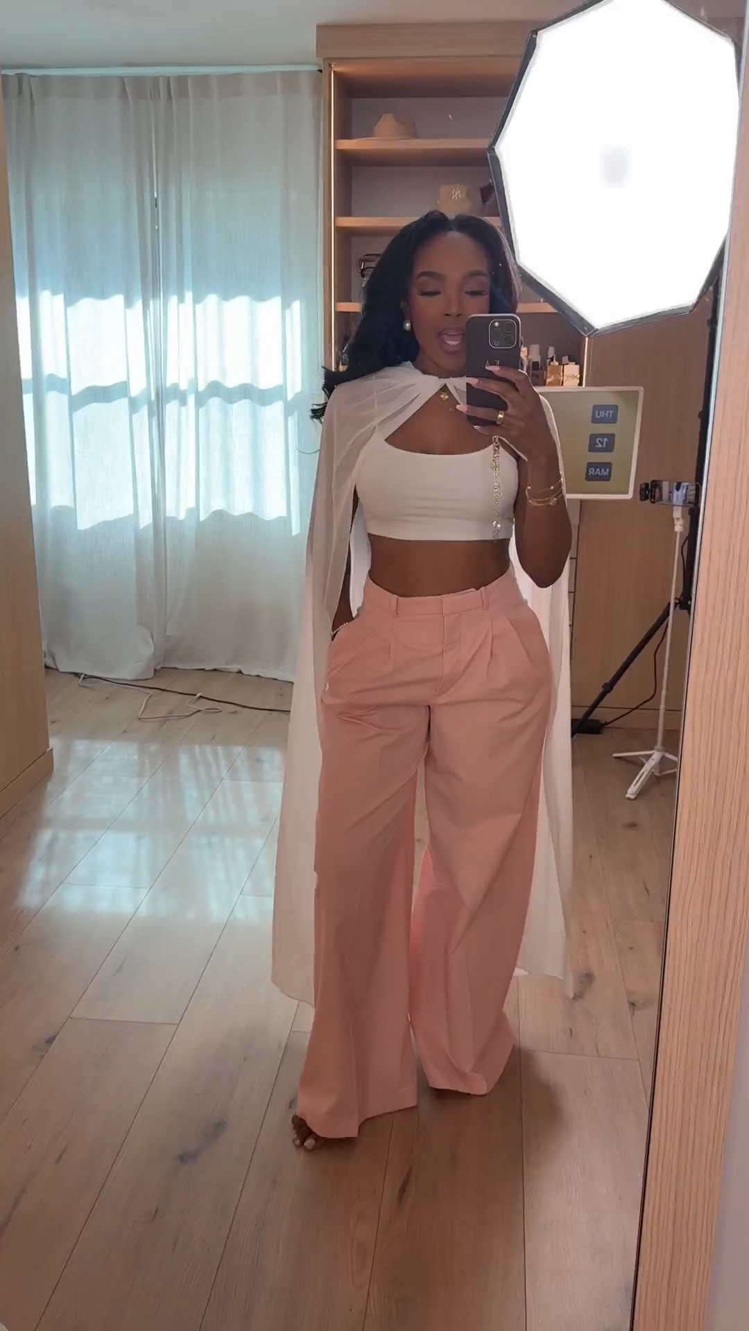 Scroll to shop this soft, feminine outfit featuring tailored blush wide-leg trousers styled with a white crop top and a lightweight cape layer for an elegant, elevated look. The structured trousers balance the cropped silhouette while the neutral palette keeps the outfit timeless, making these pieces easy to style multiple ways so the cost per wear continues to drop over time.

Perfect for brunch, spring events, vacation dinners, girls night, or elevated daytime outfits.

5'4" | 138 lbs | 34D bust | 27" waist | 40" hips

Follow me on Instagram and YouTube @kirasfashionfinds @Zara 

#LTKSpringSale @Zara 