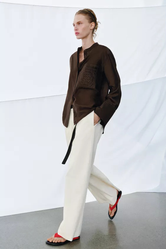 ZARA WOMAN COLLECTIONRound neck shirt with long sleeves and cuffs. Featuring a patch pocket on th... | Zara UK