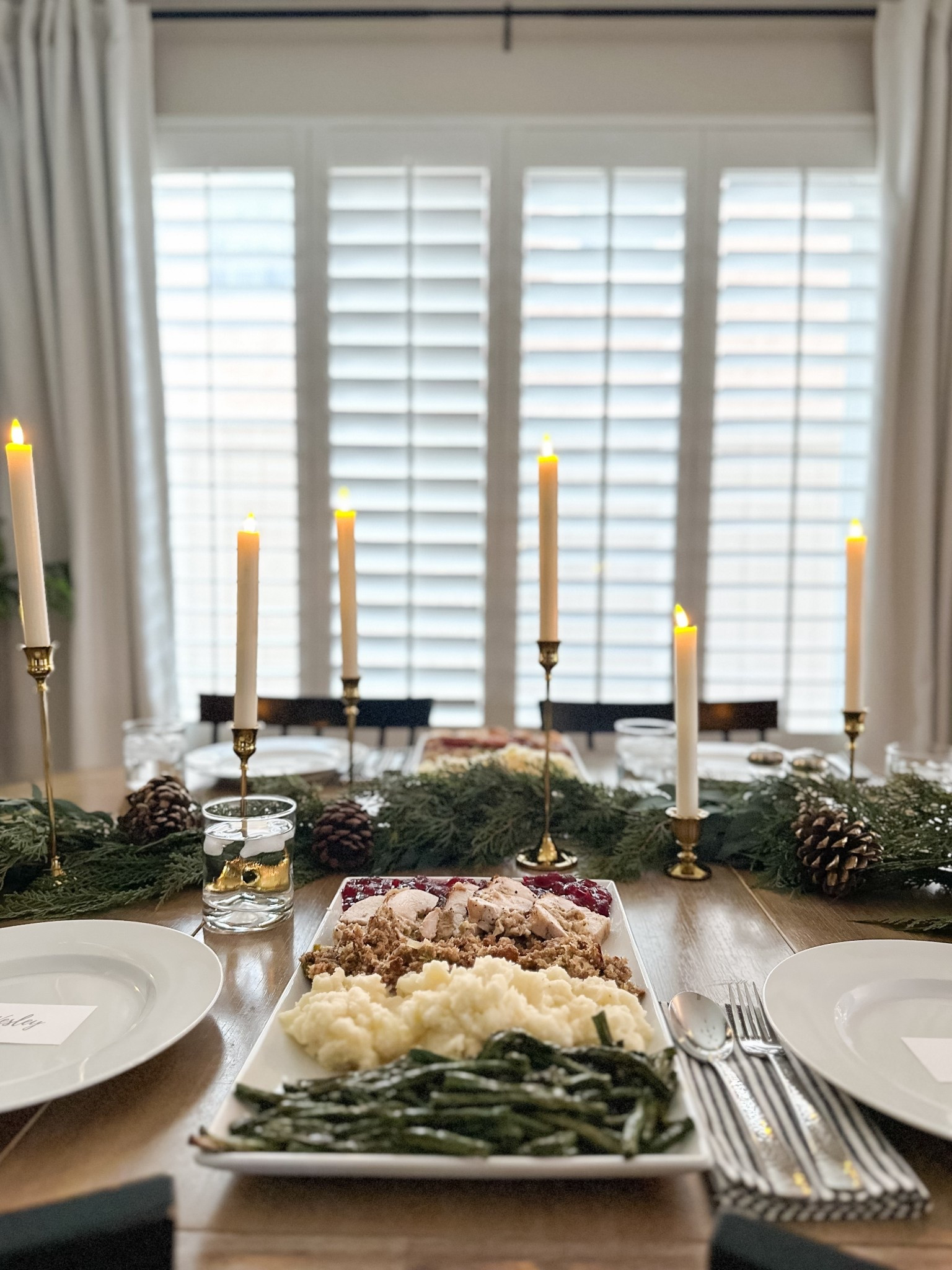 Holiday table setting

Flameless taper candles
Gold taper candle holders 

#LTKHome #LTKSaleAlert #LTKHoliday