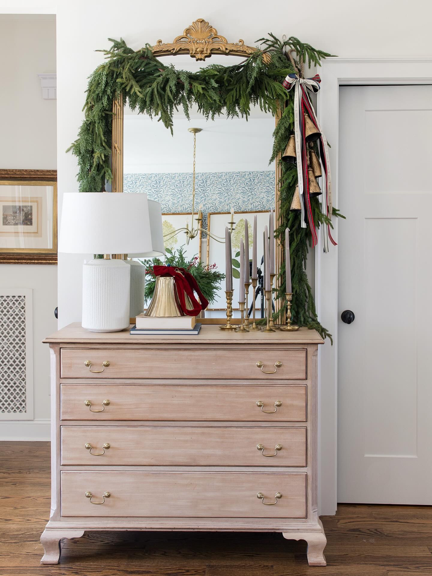 Simple garland ribbon and bells for the entryway 

#LTKHome #LTKHoliday #LTKSeasonal