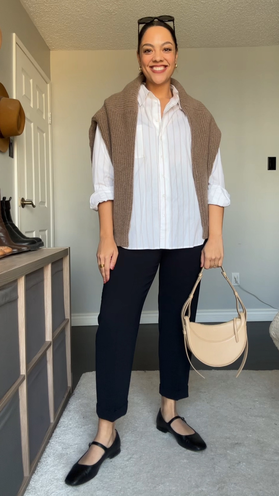 Ways to wear a crewneck sweater! Details below:

-Poppy Barley crewneck sweater in the colour dune. Made with 100% superfine lambswool. Super soft and versatile! I’m wearing a large. 
-Reformation striped button up shirt, I have a medium. 
-Black tapered pants, similar linked. 
-Poppy Barley black leather Mary Jane flats. 
-COS gold mini hoops. 
-Celine Triomphe 52mm sunglasses in black acetate. 


#LTKstyletip #LTKSeasonal #LTKfindsunder100