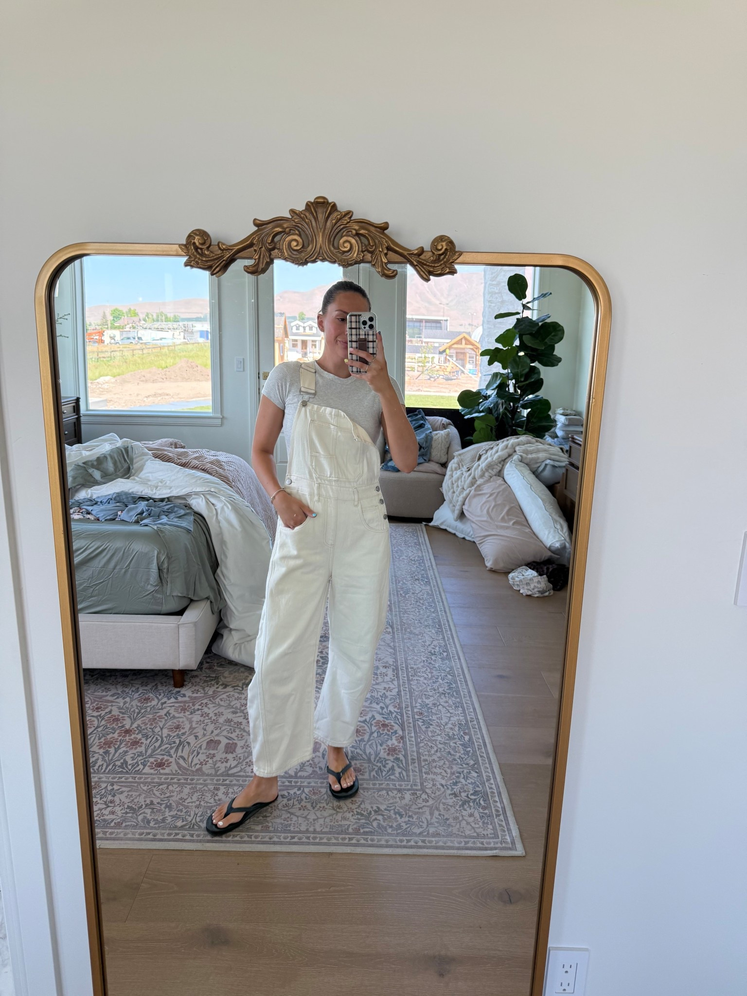 Wearing a size small in the overalls and size 8 in the flip flops!