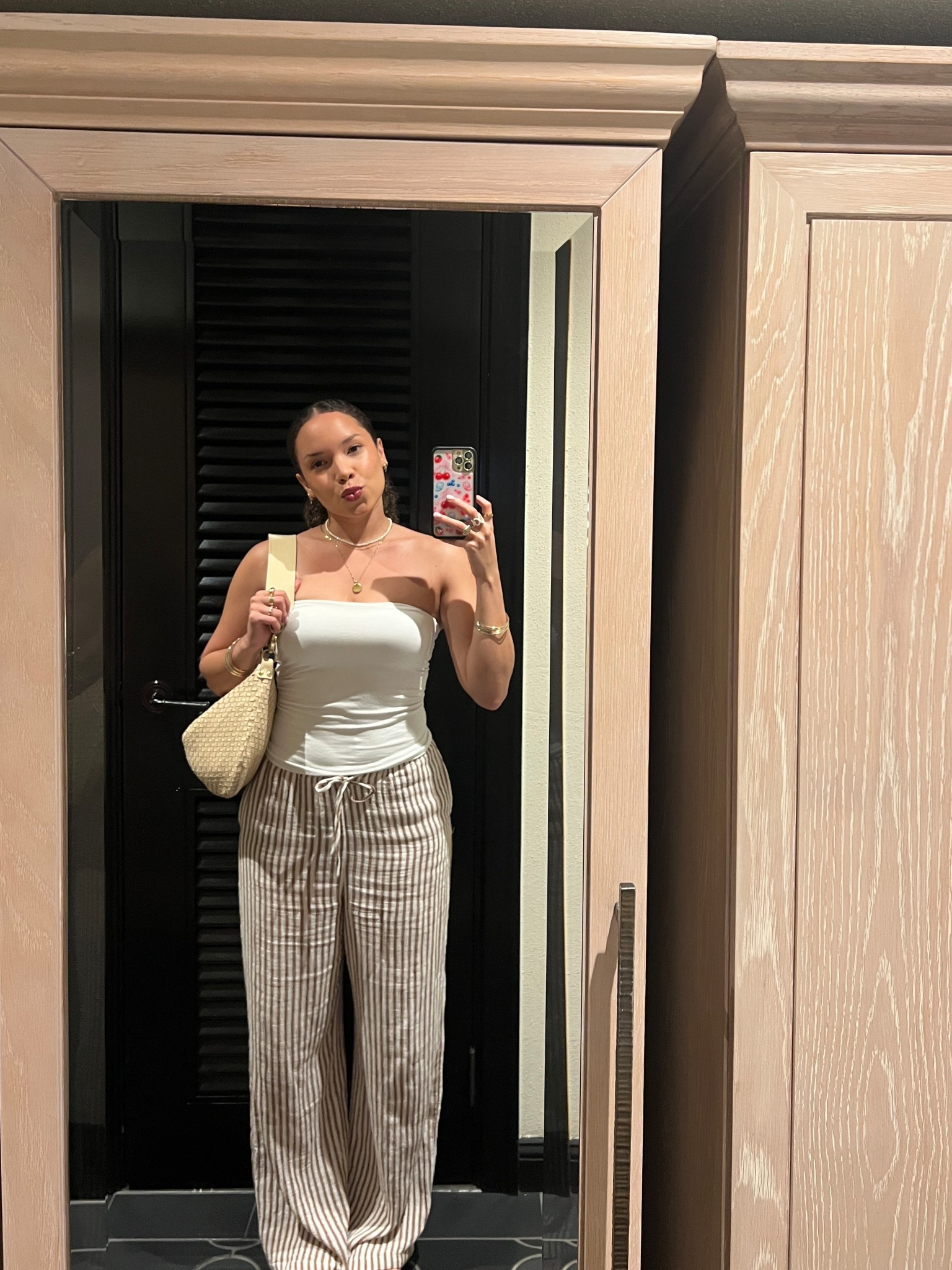 Casual spring summer vacation outfit wearing a wire tube top and striped linen pants 🤍 use code “stylegoals” for a discount at city beach! 

#LTKItBag #LTKFestival #LTKSeasonal