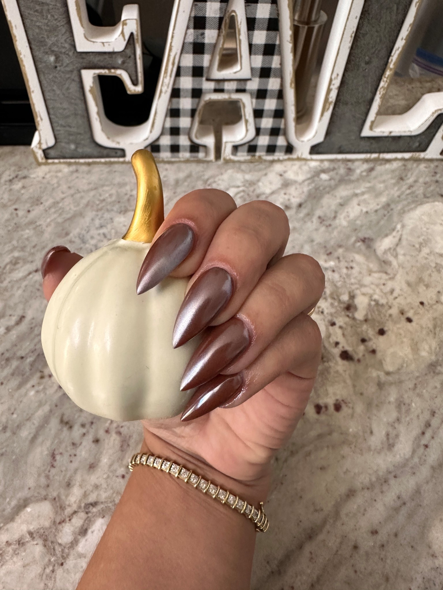 Brown chrome October nails. 

#LTKBeauty #LTKSeasonal #LTKHalloween