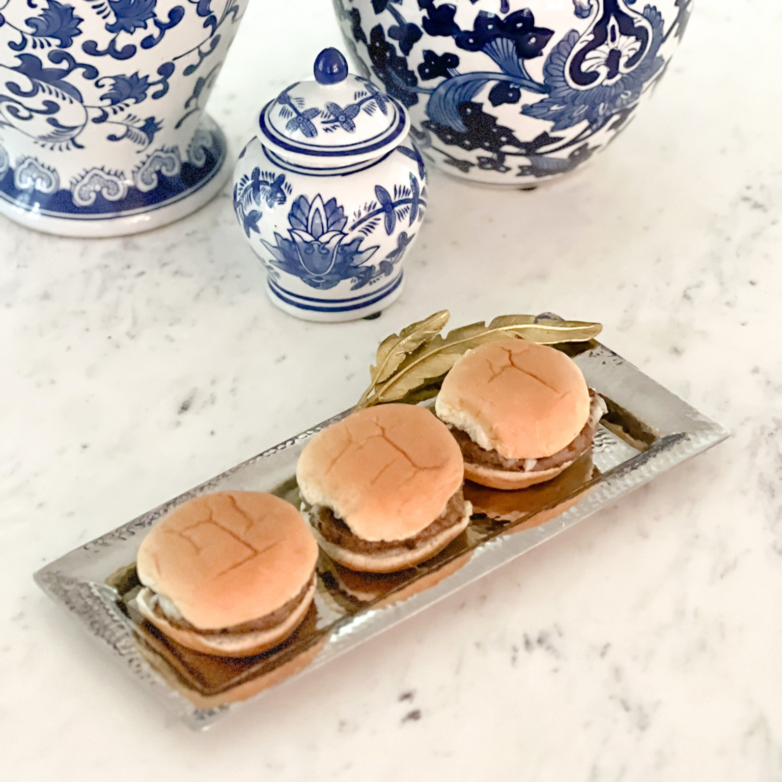 Get the perfect size mini burgers when it comes to bun to burger ratio when you make sliders next by using these egg rings to shape one pound of beef into six  patties. Gold feather Michael Aram cracker tray  

#LTKhome #LTKsalealert #LTKparties