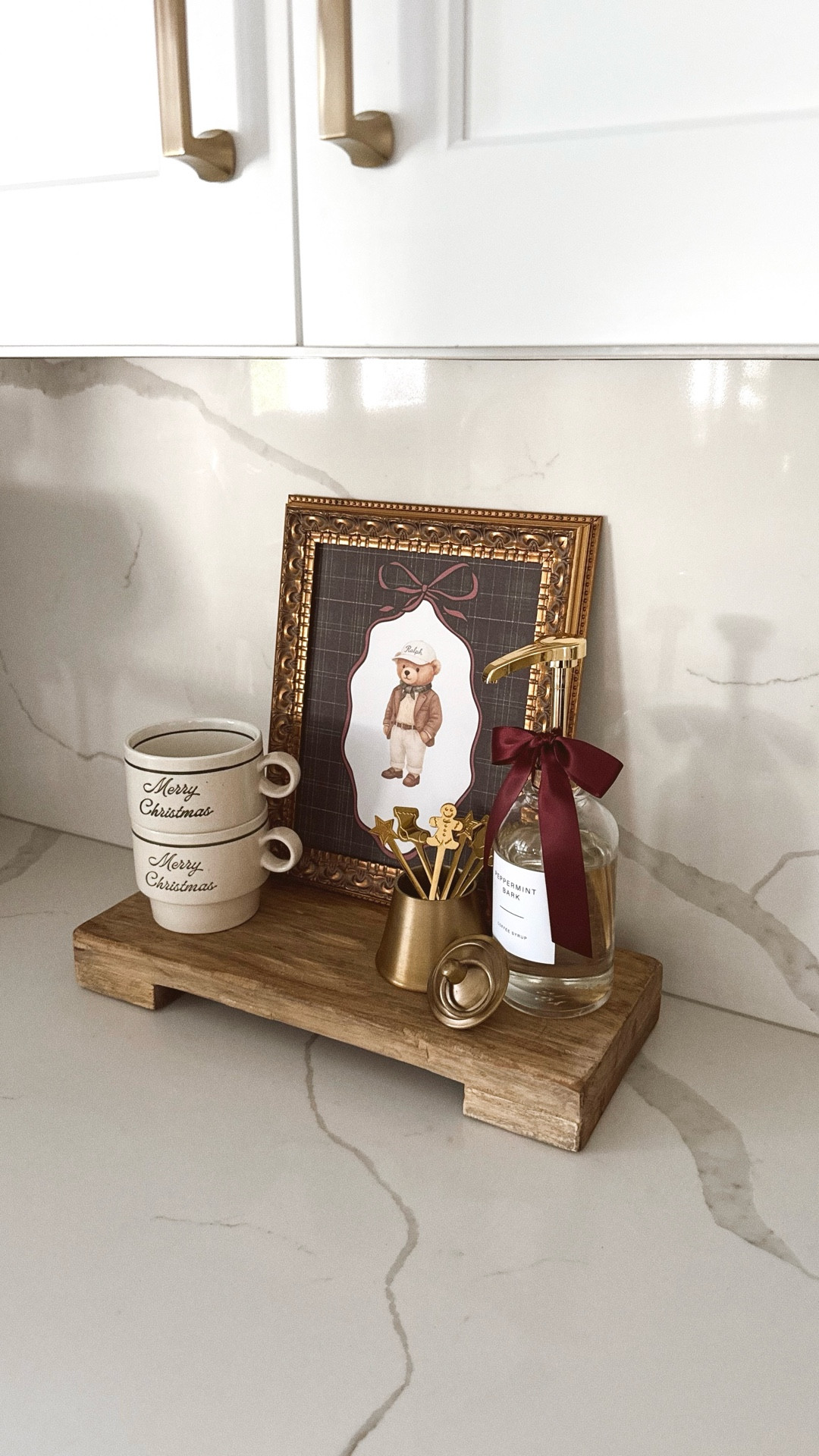 If Ralph Lauren had a Christmas coffee bar 🤎☕️🎄
I styled this little corner with the cutest Ralph-inspired Target mugs, a recycled bell candle holding my Christmas coffee spoons, peppermint syrup for that cozy café moment, and the most adorable plaid bear graphic to tie it all together. It’s giving luxe, warm, classic holiday vibes 🥰 the kind you want to wake up to every morning.

#ralphlaurenchristmas #christmascoffee #christmascoffeebar #holidayhome #coffeebar #christmasdecor #kitchen #christmasdecor2025 #targethomefinds

#LTKHoliday #LTKFindsUnder50 #LTKHome