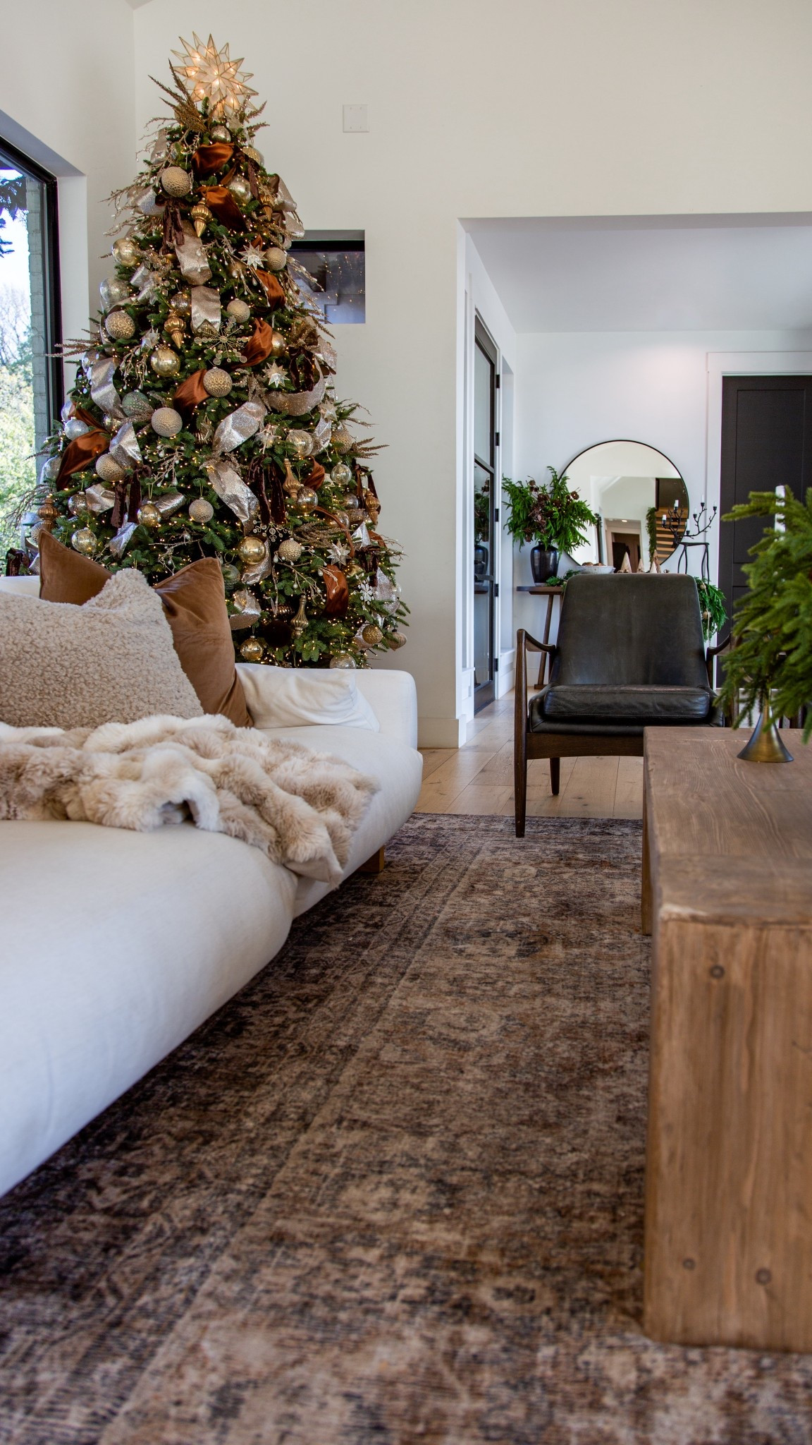 Cozy corners and Christmas glow — this room feels like home right now.
Our Loloi Morgan Sunset/Ink rug might be my favorite piece in the entire space and it’s 65% off today. The pattern, the warmth, the lived-in vintage feel — truly the rug that ties everything together.

Layered with our Castlery white sofa, Eternity Modern coffee table, and Magnolia leather armchairs, it’s the perfect balance of modern, timeless, and cozy. I added fur blankets + throw pillows from Amazon to soften the look and bring in texture for winter — highly recommend if you want a space that feels warm and inviting without losing its clean design.

If you’re shopping living room pieces, everything is linked — and several are on major sale.
A good rug, a good couch, a little texture, and you’re golden.

Loloi rug sale, vintage style rug, Castlery couch, modern living room, leather accent chairs, cozy winter decor, Amazon pillows, neutral home design 

#LTKCyberWeek #LTKHome #LTKHoliday
