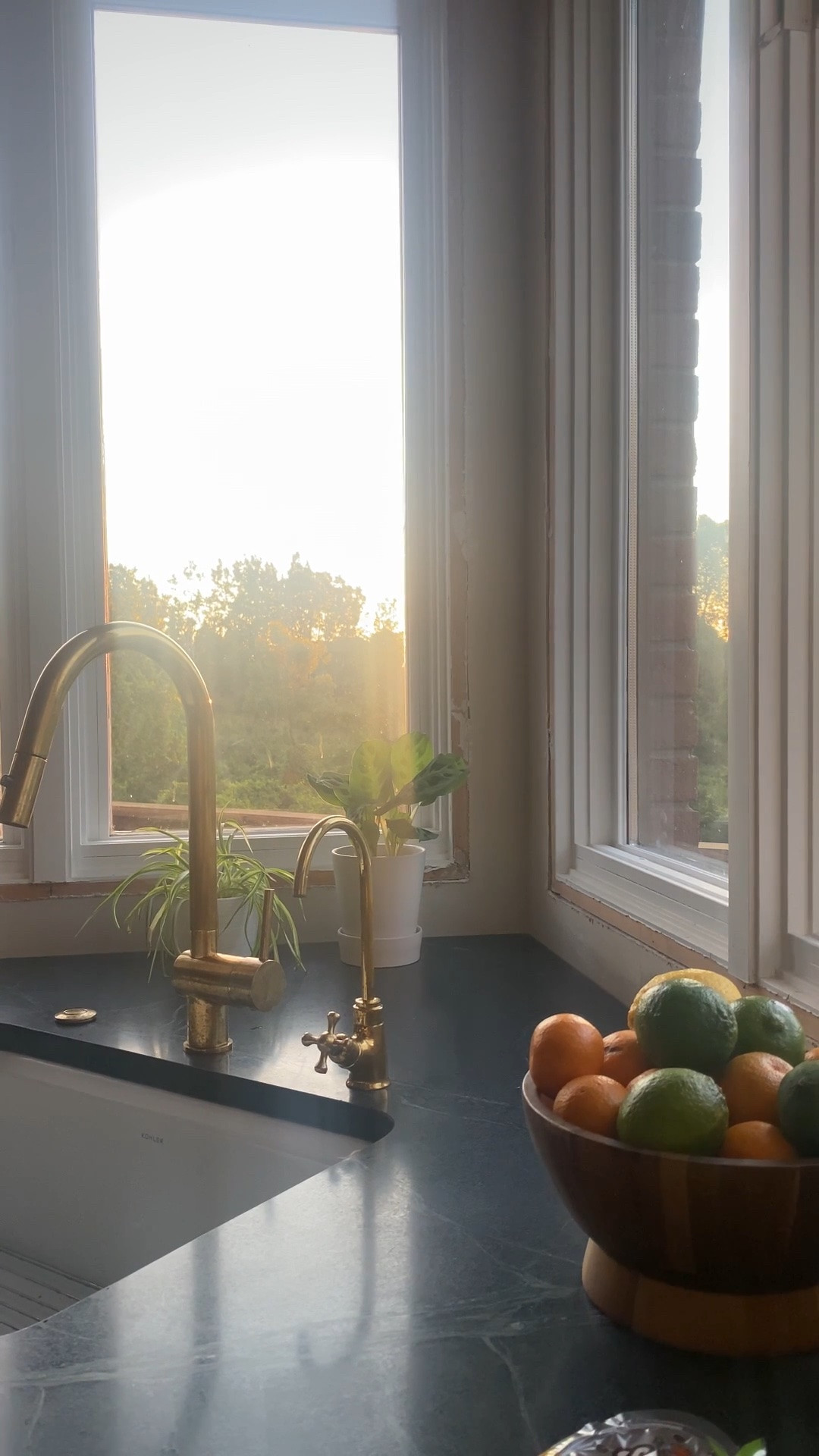 When you can finally put your decor on your new counters!

I wasn’t sure I was going to like the corner sink, and now it might end up being my favorite spot. We all know it’s only a matter of time until I fill this with plants.😂🌱

#soapstonecountertops #kitchenwindow #sunsetview #kitchendecor #homestylinginspo #unlaqueredbrass #kitchenstyle #kitchendesign #cornersink #kitchensink #kitchencounters #kitchencountertops #kitchenstyling 

 #LTKHome