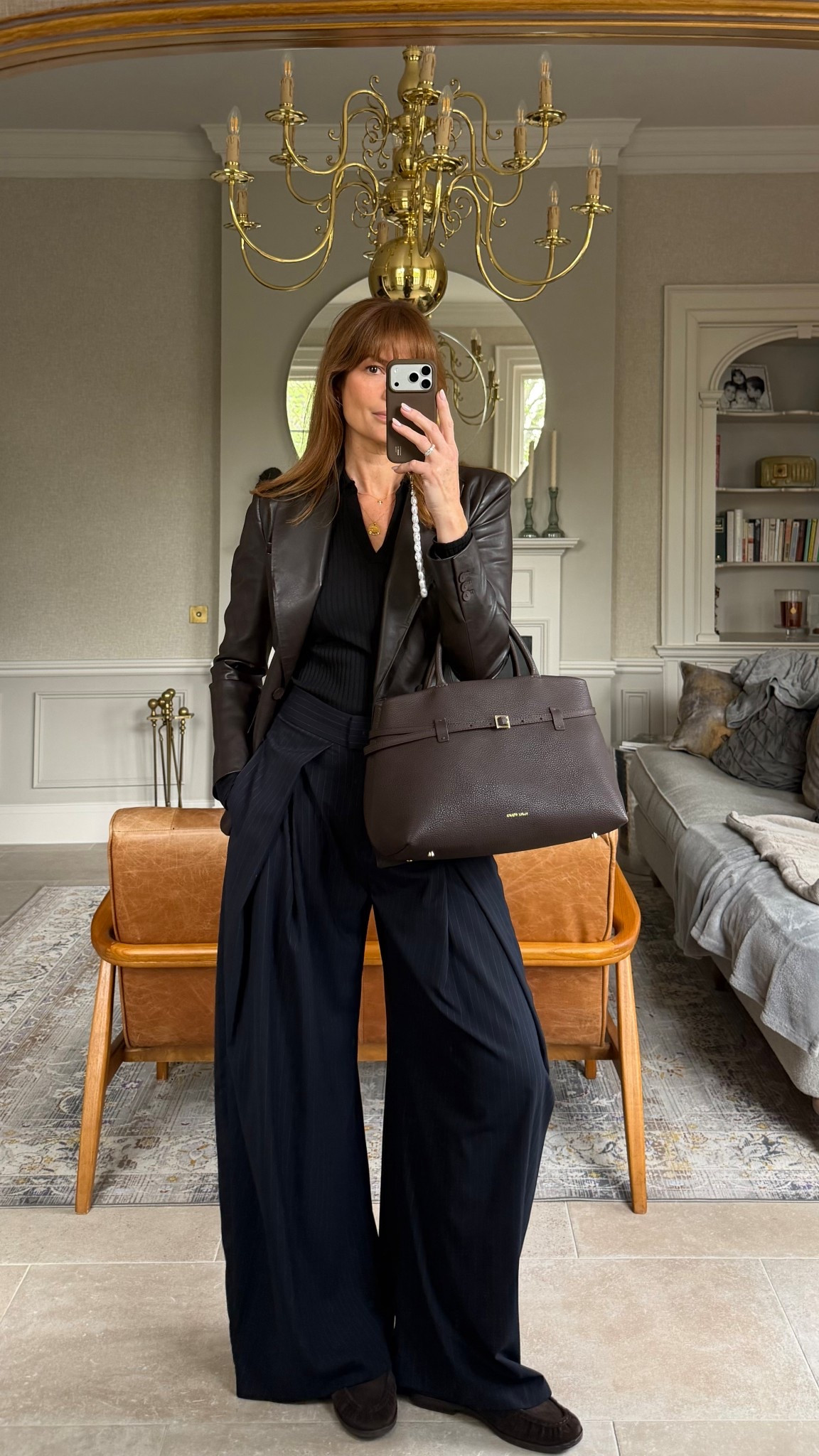Wide leg trousers, black polo neck shirt, faux leather blazer, suede loafers brown leather handbag 

#LTKbag #LTKuk #LTKspring