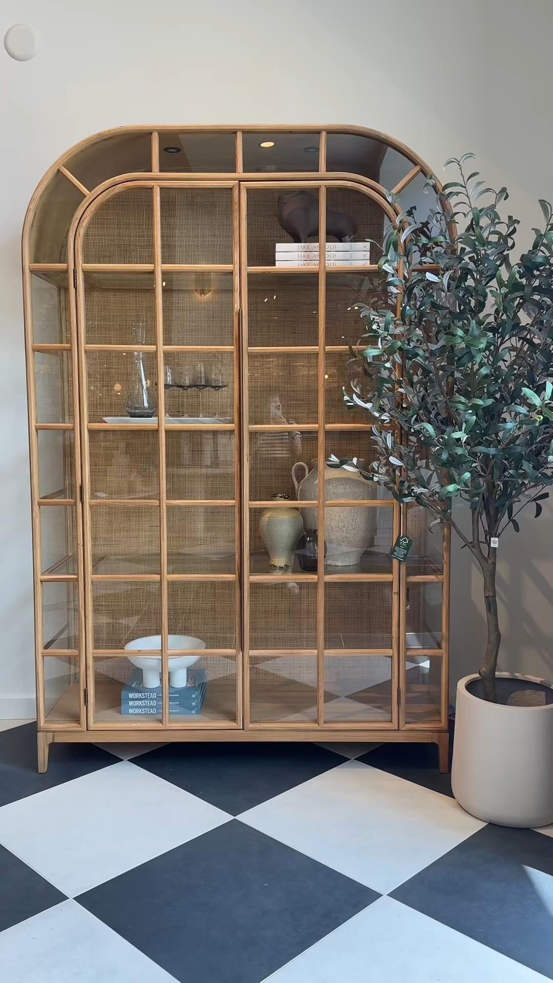 Spotted at Crate & Barrel and it’s a showstopper! 🤩 The Atrium White Oak & Rattan Lighted Display Cabinet is inspired by vintage Parisian architecture, with airy glass panels on three sides that let the light shine through. 💫 The woven rattan back adds warmth and texture, while built-in LED lighting gives your glassware, books, or art their own spotlight—day or night. 🌟The rye-finished white oak frame and subtle brass hardware make it feel both timeless and elevated. Such a beautiful statement piece that instantly transforms a room! ✨

#CrateAndBarrel #DisplayCabinet #NeutralHome

#LTKStyleTip #LTKHome #LTKSaleAlert