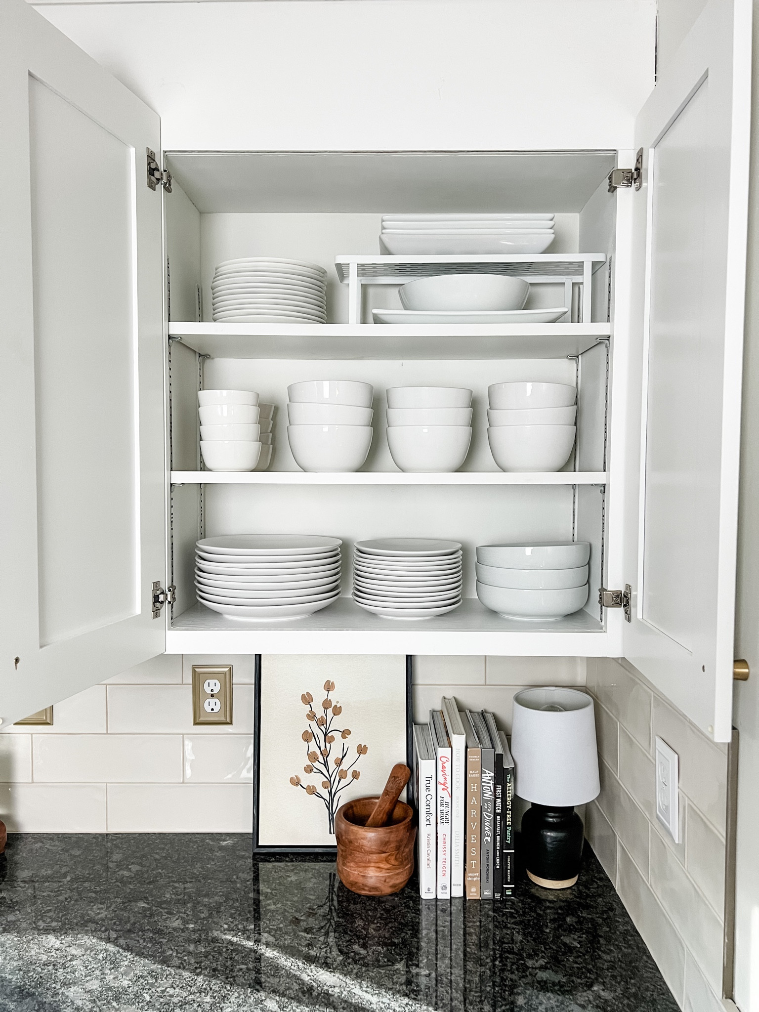 Simple white dishes organized in kitchen cabinet. These dinnerware sets are super affordable and are very thick and sturdy. I bought three sets so we’d have enough for big family dinners.

#LTKhome #LTKfamily #LTKSeasonal