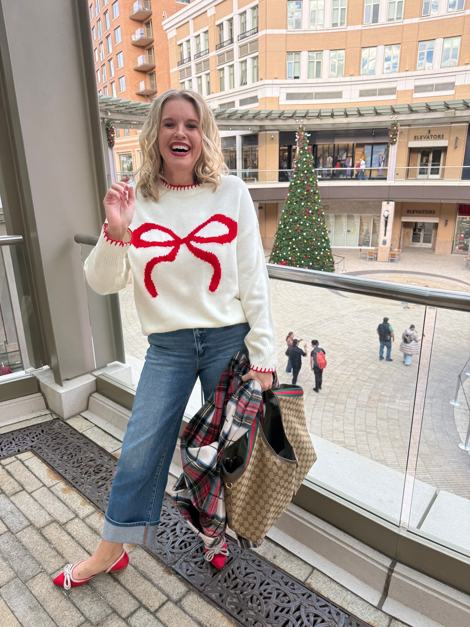 The cutest 🎀 sweater 
Wear alone or layer a plaid button up underneath ❤️🌲
Fits tts and I got a med (that’s what I wear on Amazon) $24

Social threads cited jeans 
The best under $70 jeans
Fit tts I am in a 27 and there great quality 

Red plaid coat was old from a couple years ago old navy! Linked similar 

Red satin bling bow flats are old from Target linked similar 

Gucci bag/tote 


#LTKootd #LTKHoliday #LTKSaleAlert