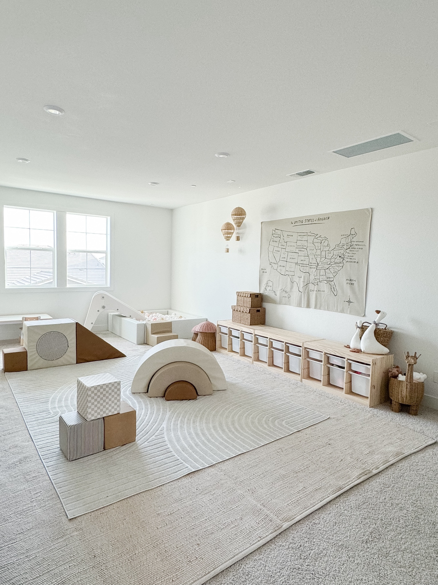 We originally intended to use our second-floor loft as a movie room but after having our baby girl we decided to switch gears and use it as her playroom. I'm so happy we did! We love to see her crawling around enjoying the space. Having this dedicated playroom helps us keep most of her things confined to one area of the home which we appreciate because it helps us keep the first floor nice and tidy while still allowing her to have plenty of space for play upstairs.

#LTKFamily #LTKHome #LTKKids