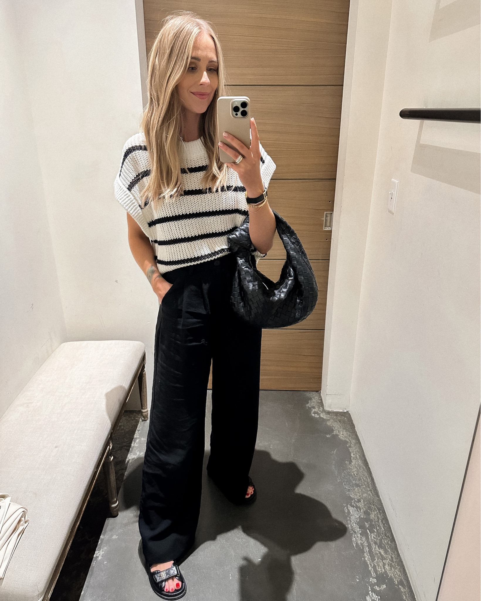 Fashion Jackson wearing stripe sweater tank (xs/s) black wide leg pants (small) black sandals, bottega handbag #fashionjackson #trousers #sandals 

#LTKshoecrush #LTKstyletip