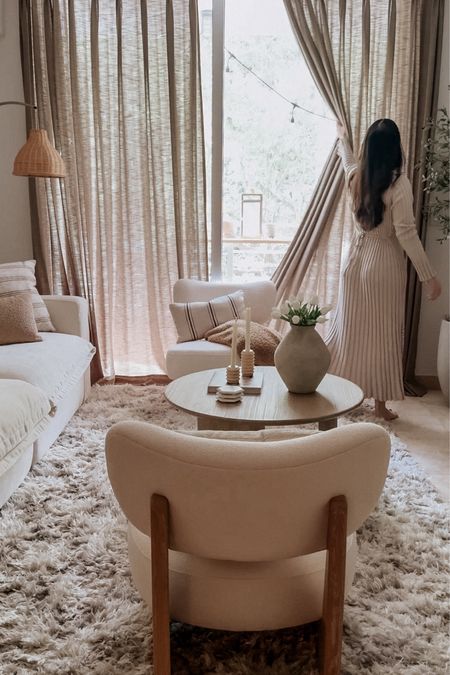 Living room moments 

Sheer linen curtains, accent chair, area rug. coffee table. Neutral dress. Lamp.  Vase. Tulips. Candle holders  

#LTKSeasonal #LTKhome